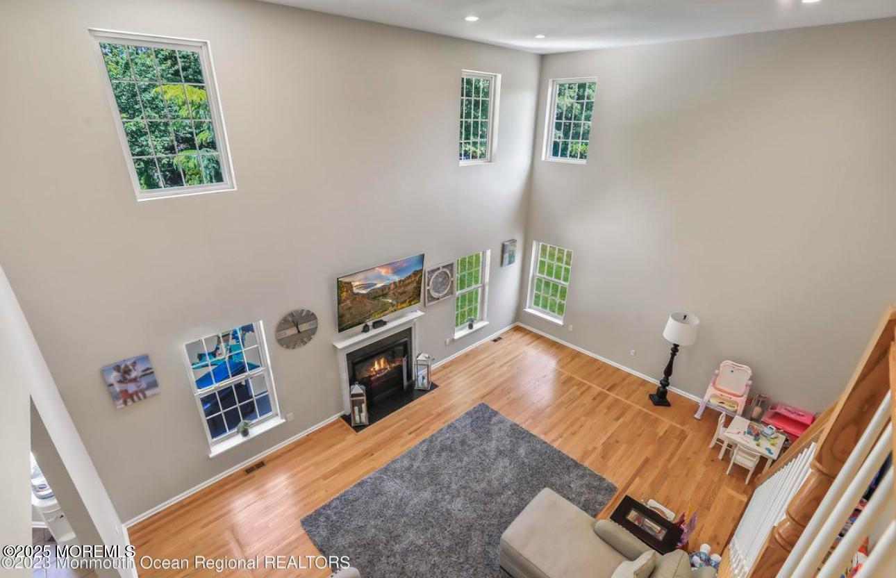 7 Round Hill Road Jackson, NJ 08527 - Photo 30 of 55 a living room with furniture and a wooden floor