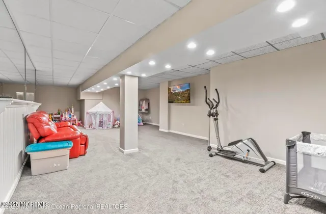 a big room with closet and large windows