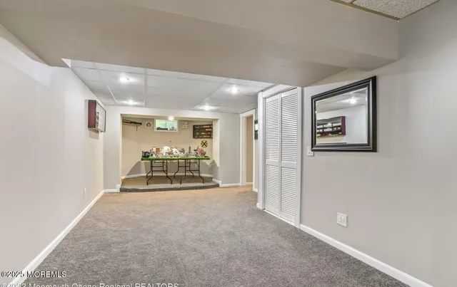a bedroom with two beds and a potted plant