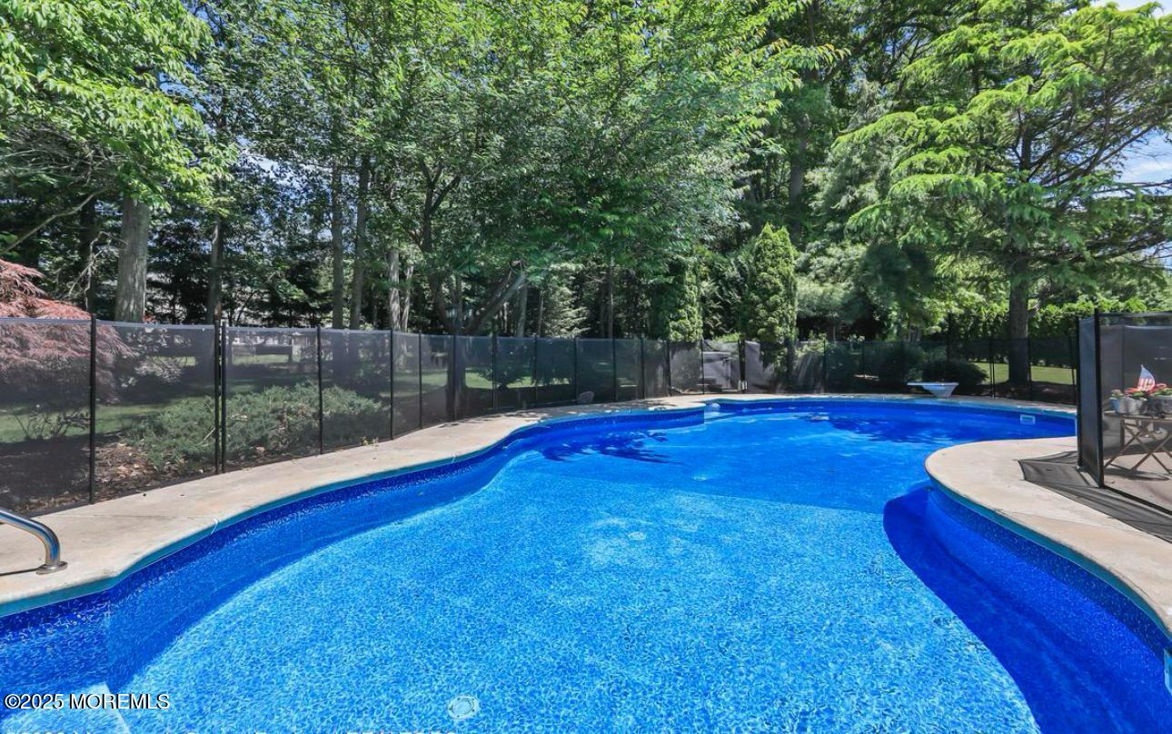 7 Round Hill Road Jackson, NJ 08527 - Photo 39 of 55 a view of a swimming pool with a patio