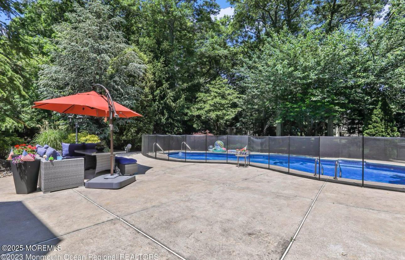 7 Round Hill Road Jackson, NJ 08527 - Photo 40 of 55 a view of a backyard with sitting area and furniture