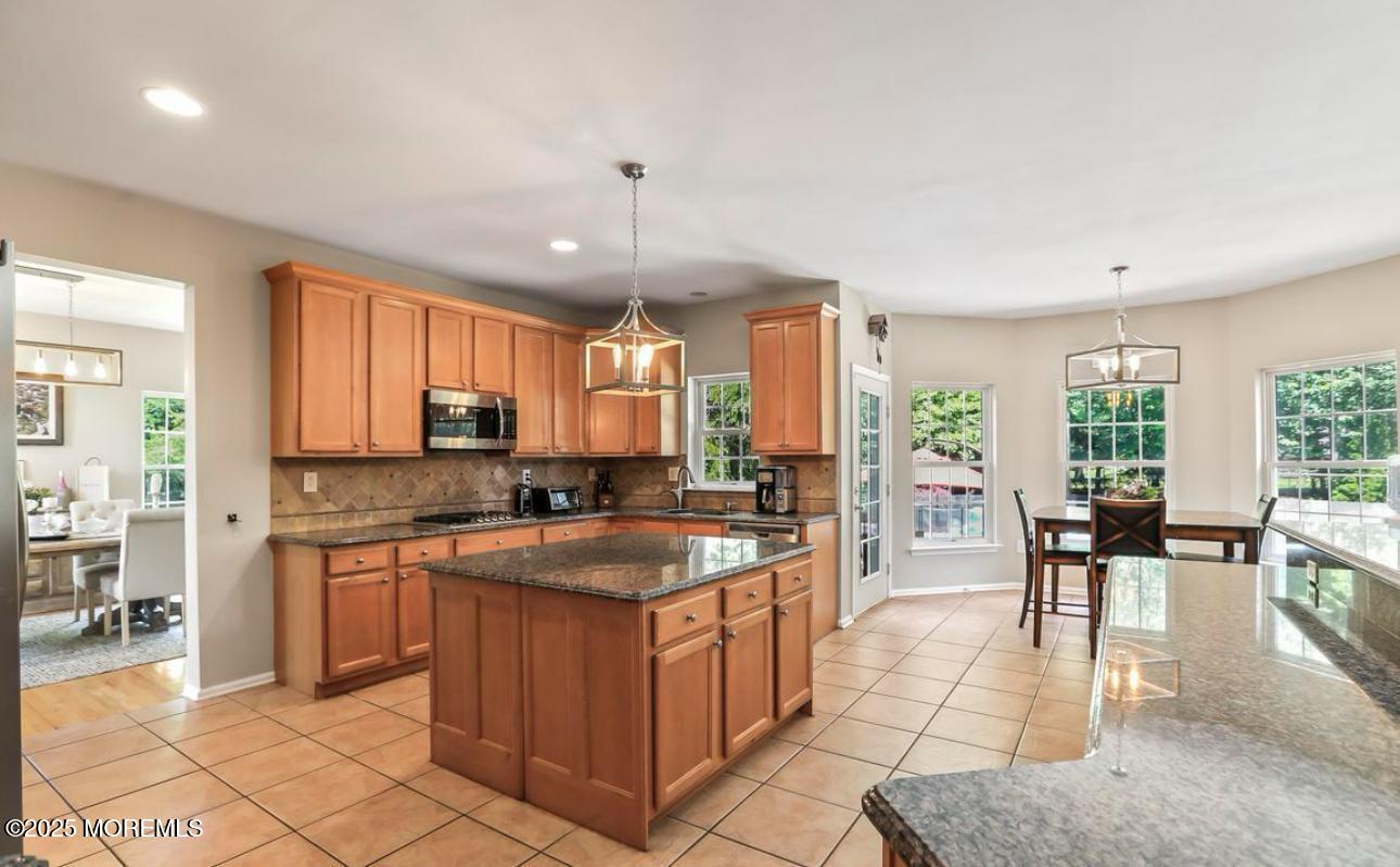 7 Round Hill Road Jackson, NJ 08527 - Photo 42 of 55 a kitchen with stainless steel appliances granite countertop a sink and cabinets