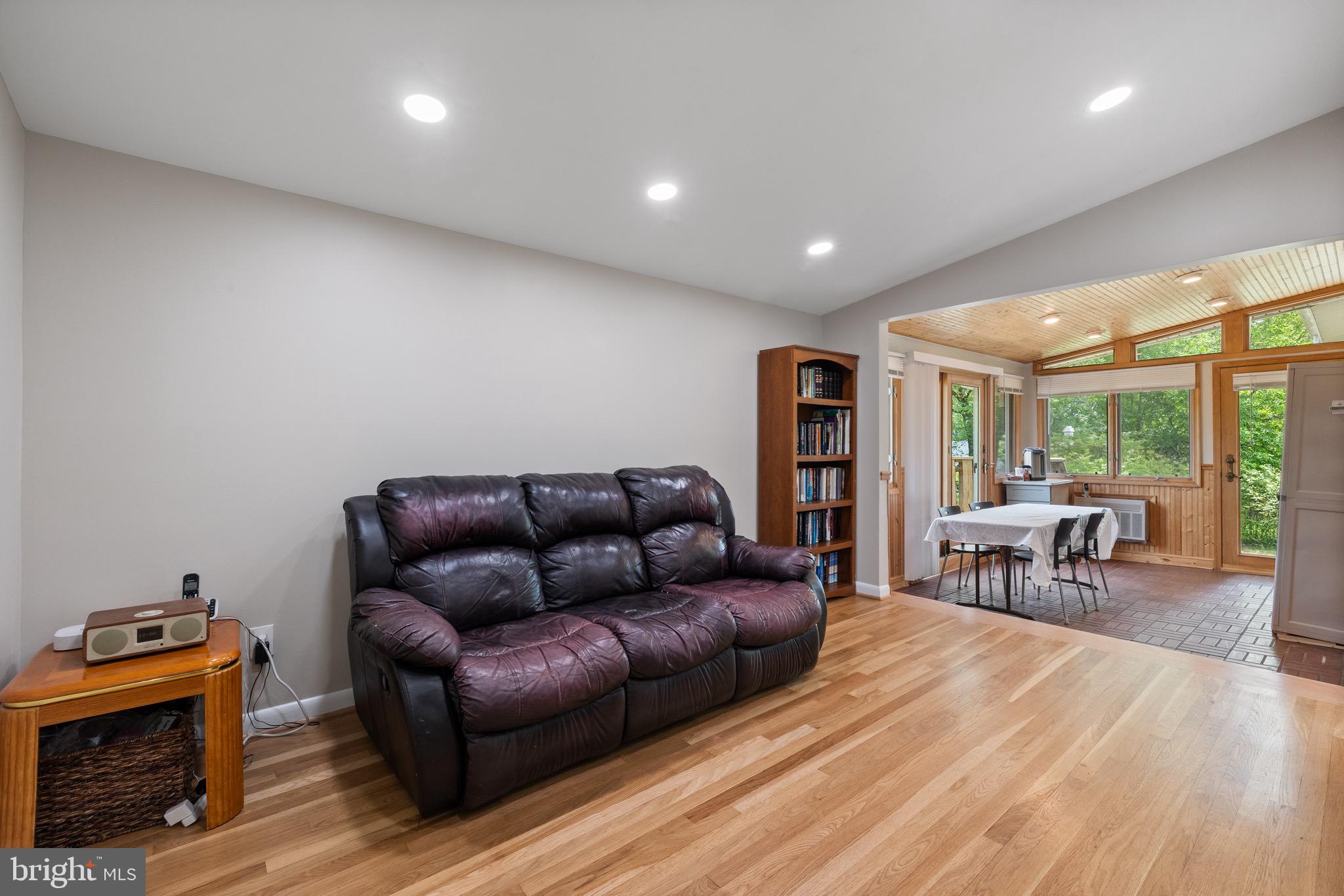 916 Hyde Road Silver Spring, MD 20902 - Photo 13 of 27 a living room with furniture and a fireplace