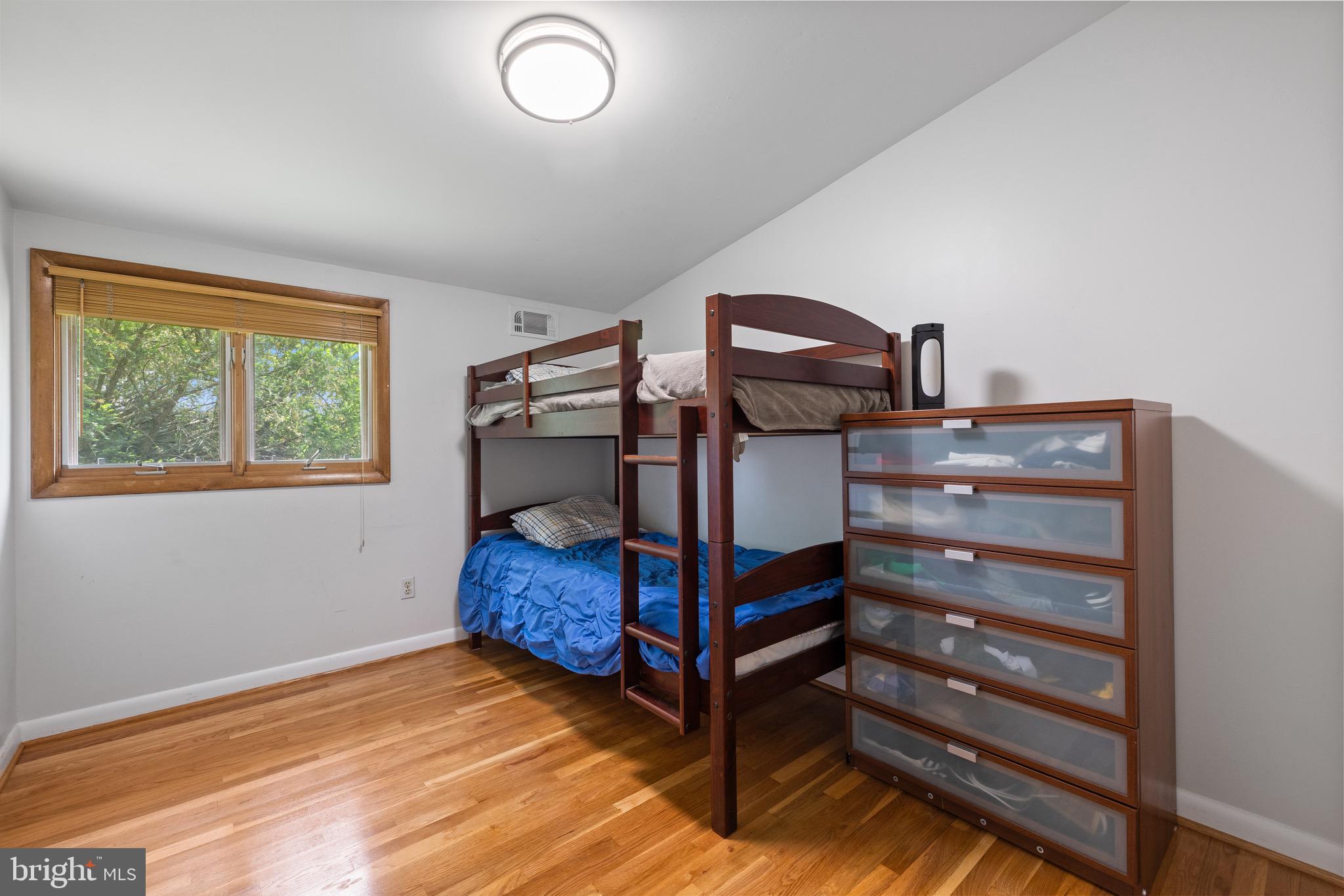 916 Hyde Road Silver Spring, MD 20902 - Photo 16 of 27 a bedroom with a bunk bed and a window