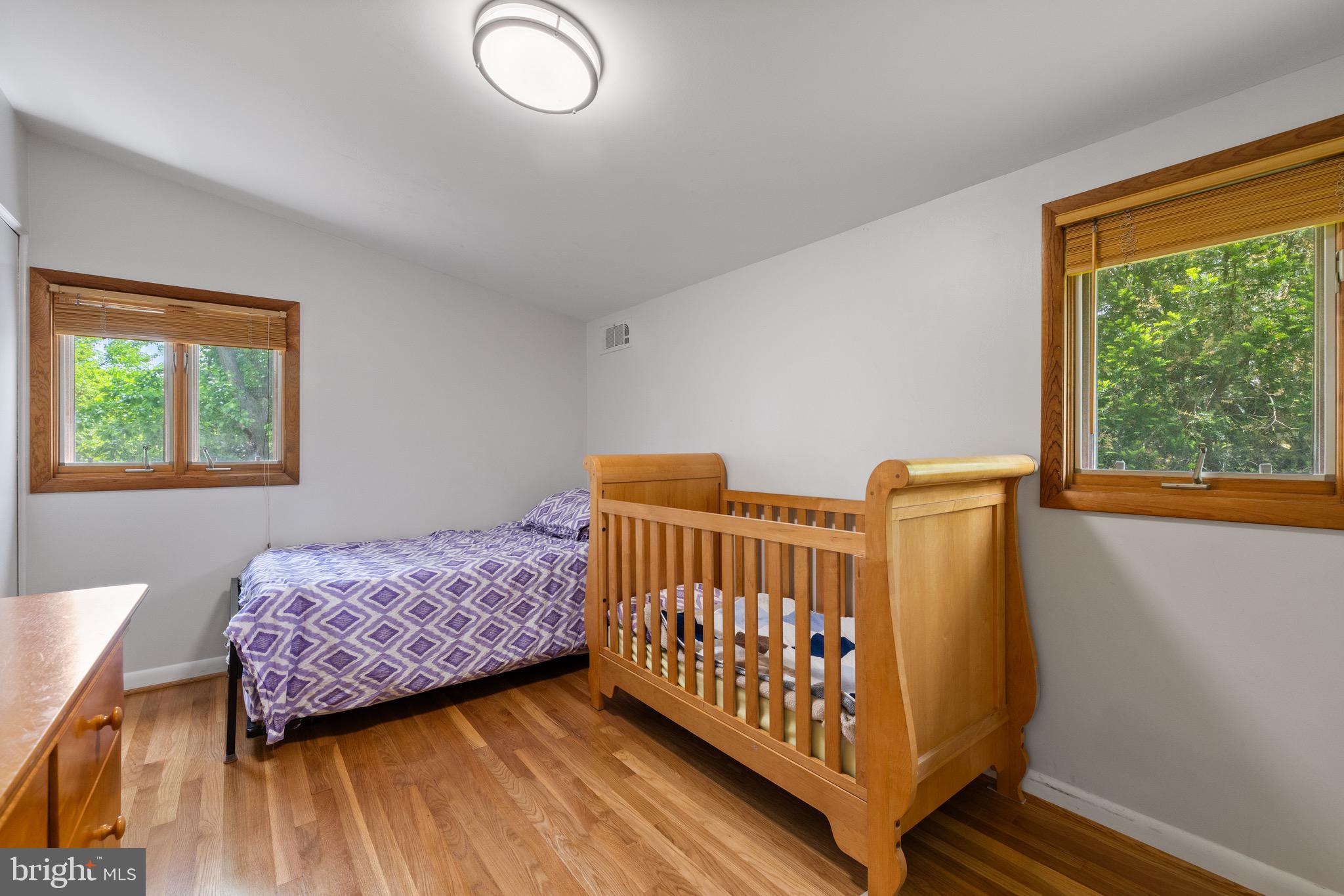 916 Hyde Road Silver Spring, MD 20902 - Photo 17 of 27 a bedroom with two beds and a window