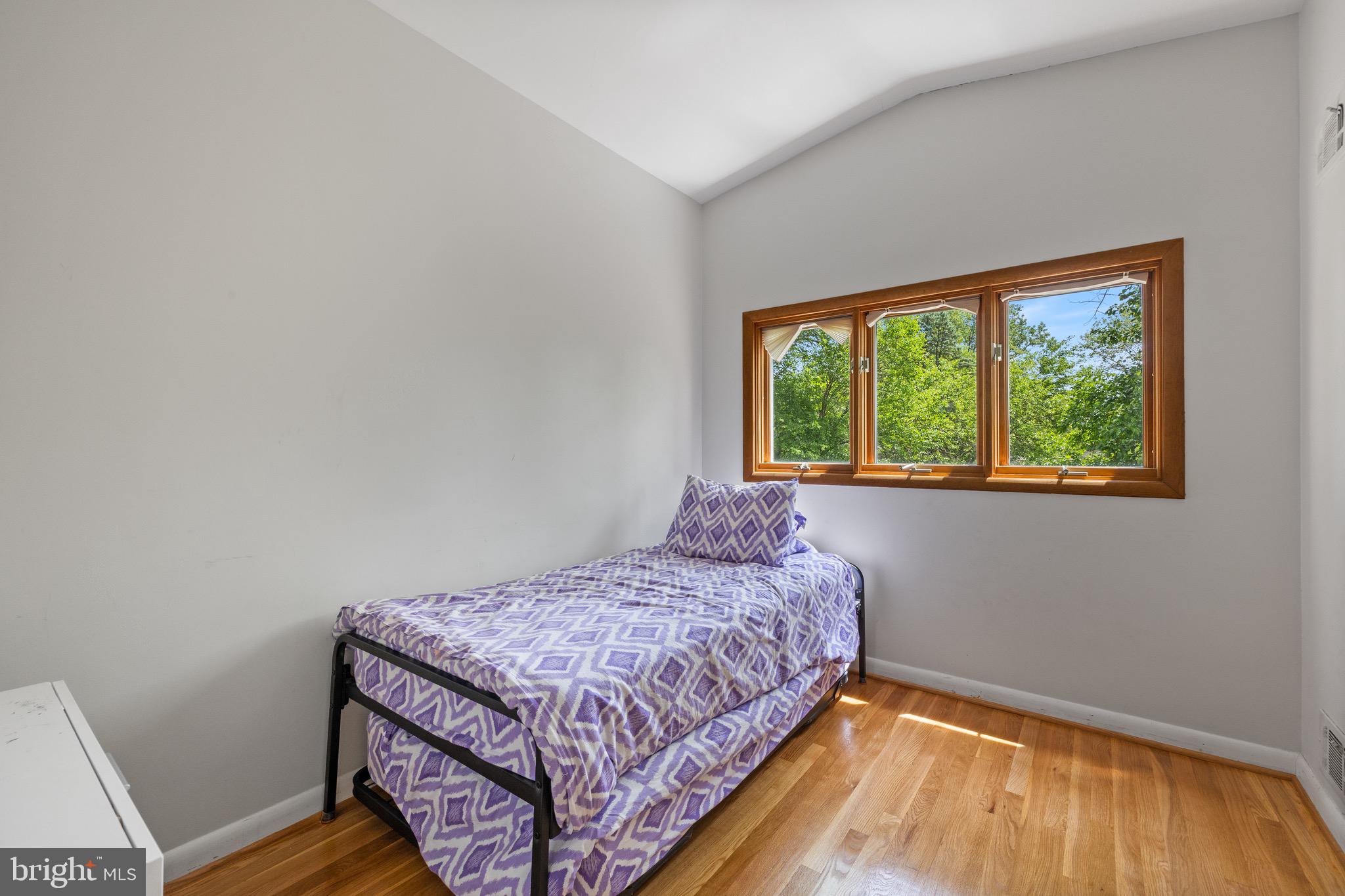 916 Hyde Road Silver Spring, MD 20902 - Photo 18 of 27 a bedroom with a bed and a window