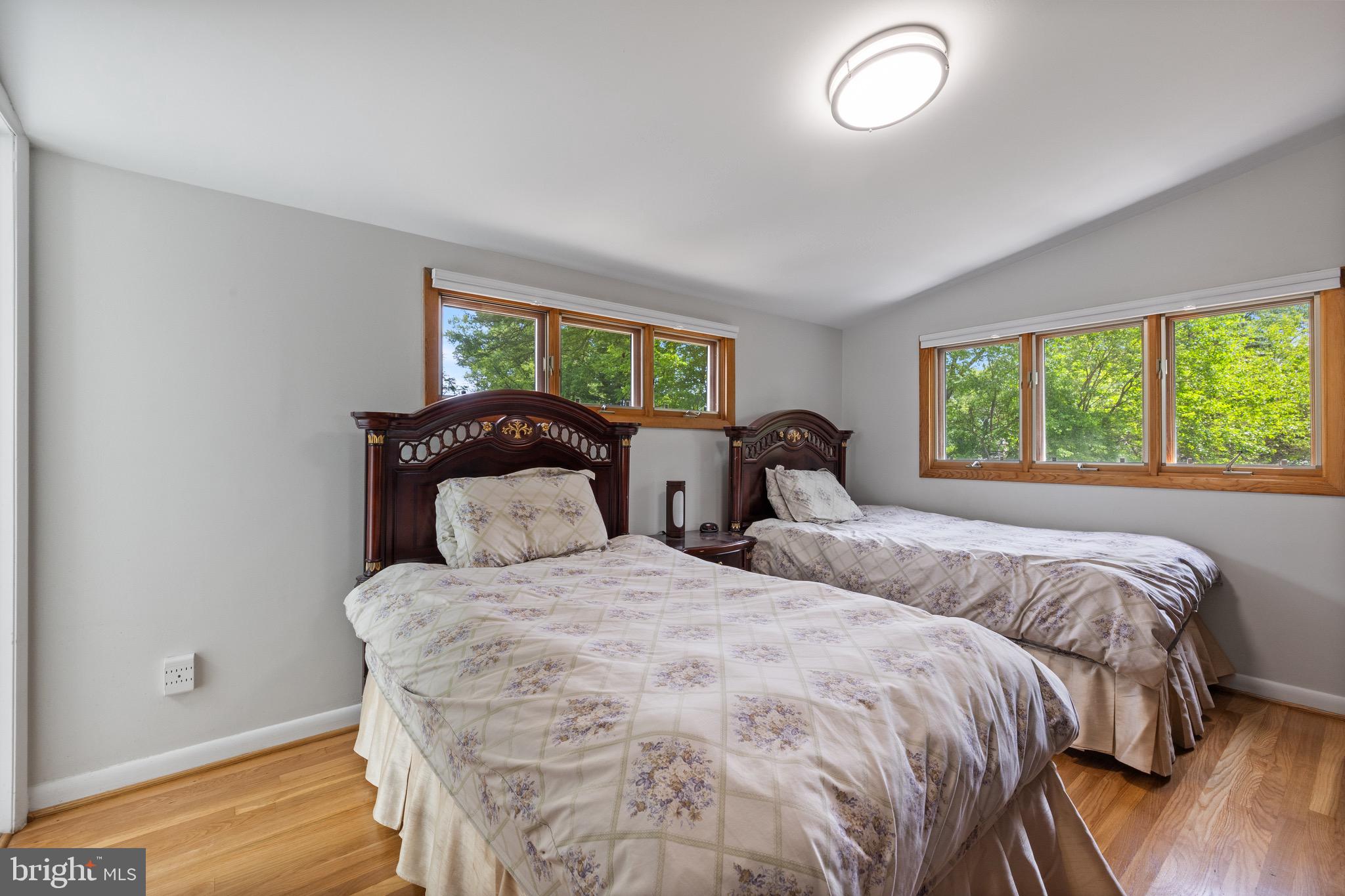 916 Hyde Road Silver Spring, MD 20902 - Photo 19 of 27 a bedroom with two beds and a large window