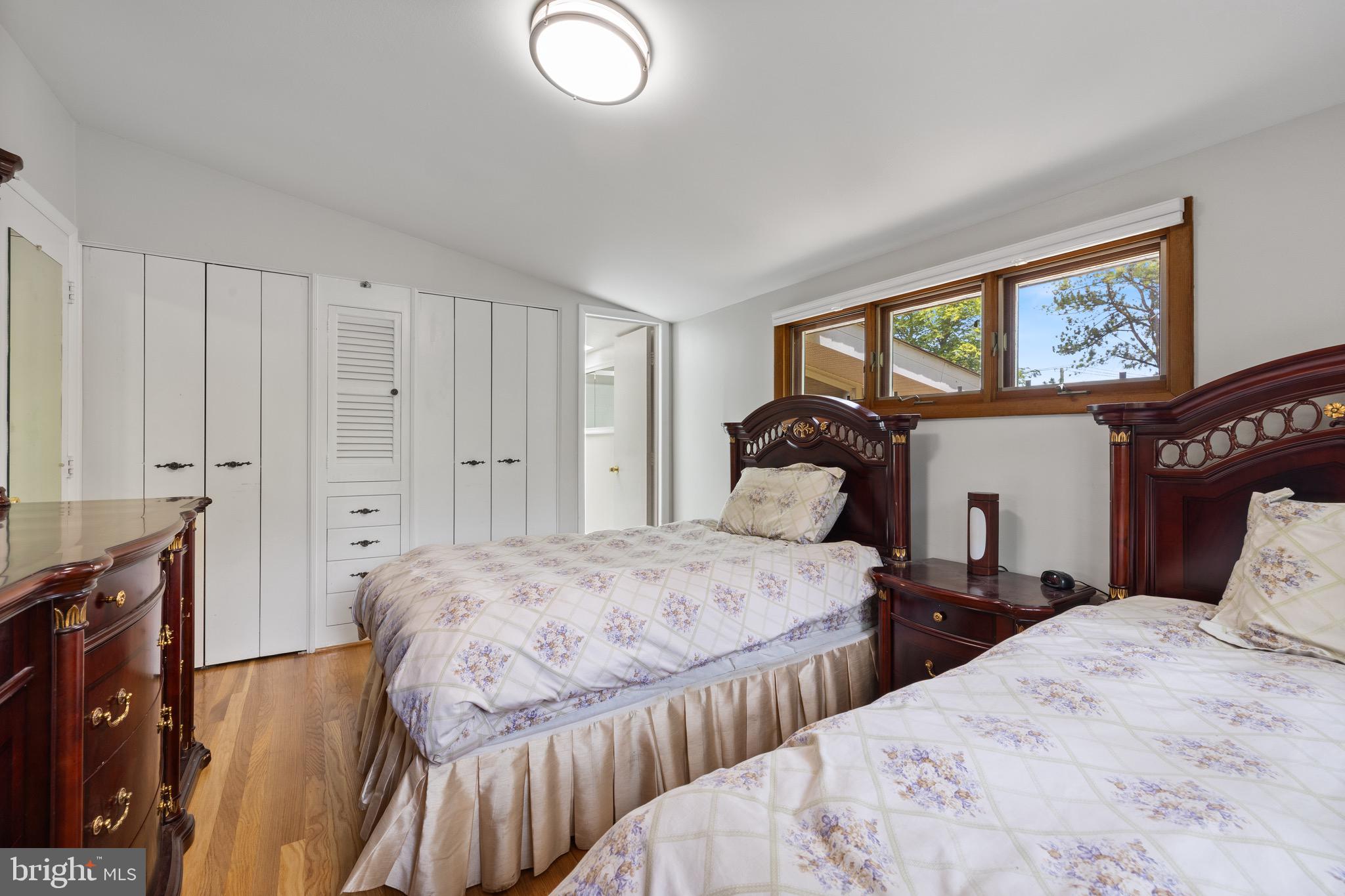 916 Hyde Road Silver Spring, MD 20902 - Photo 20 of 27 a bedroom with two beds and a closet