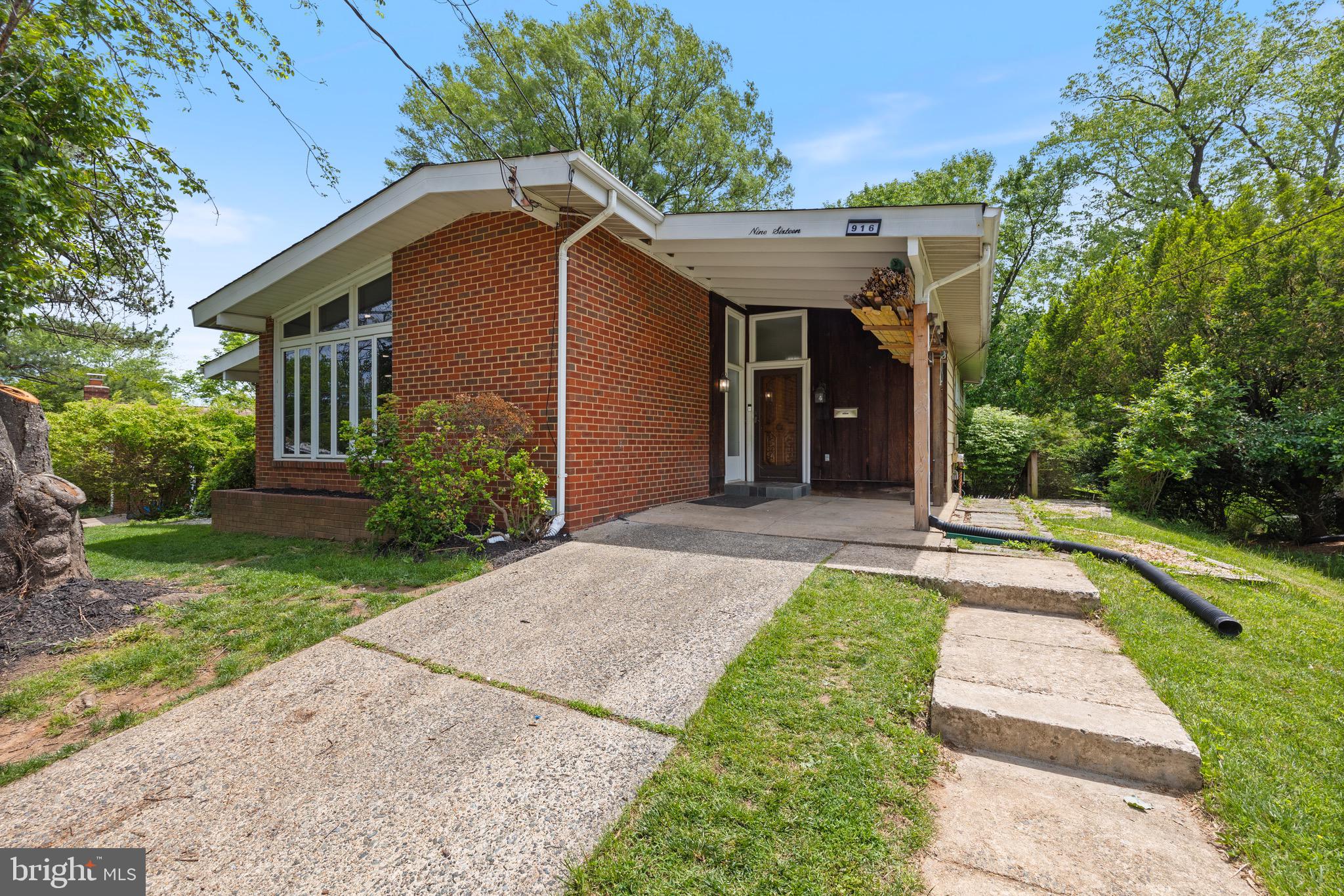916 Hyde Road Silver Spring, MD 20902 - Photo 2 of 27 a front view of a house with a yard