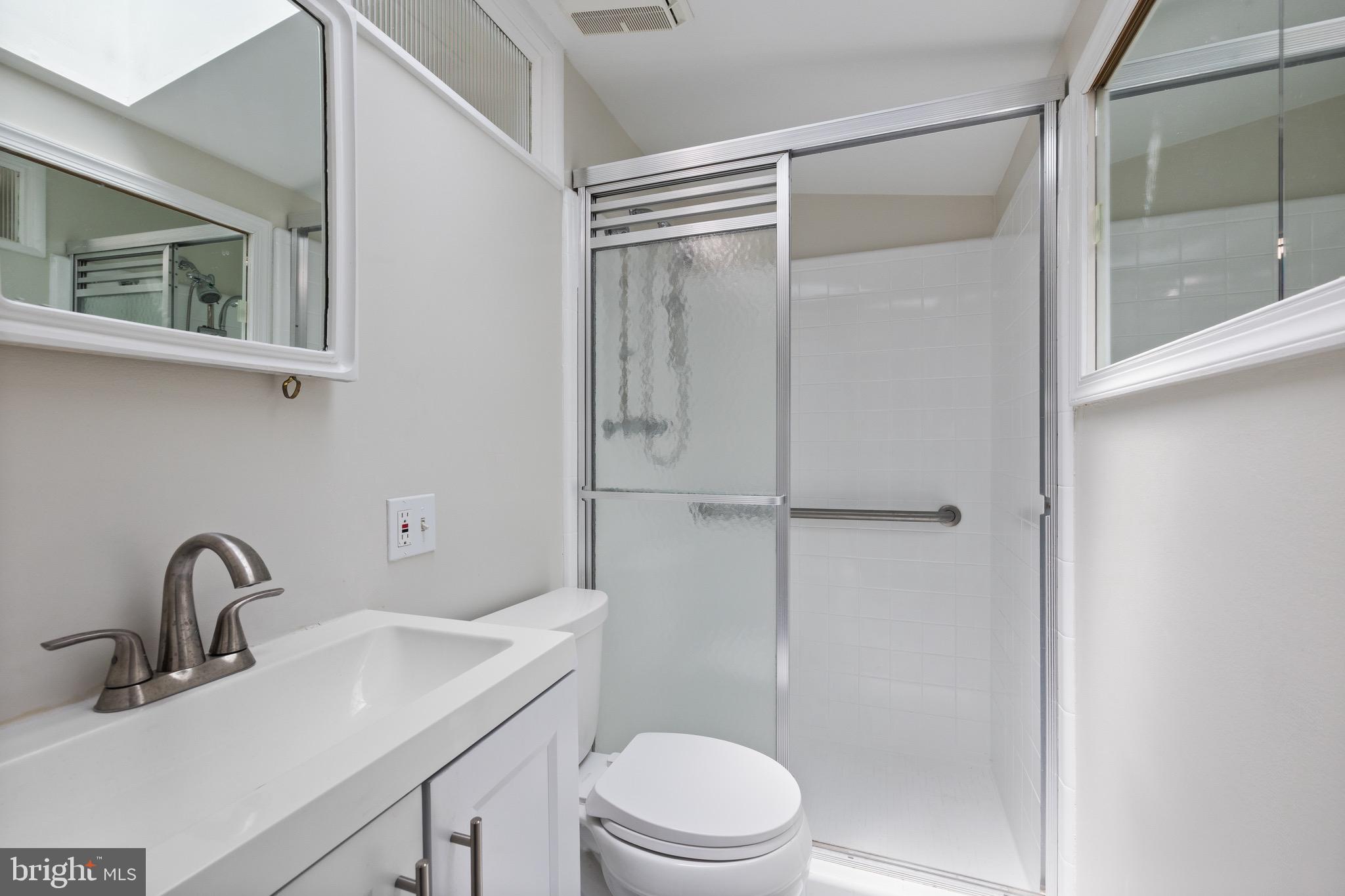 916 Hyde Road Silver Spring, MD 20902 - Photo 21 of 27 a bathroom with a sink toilet and shower