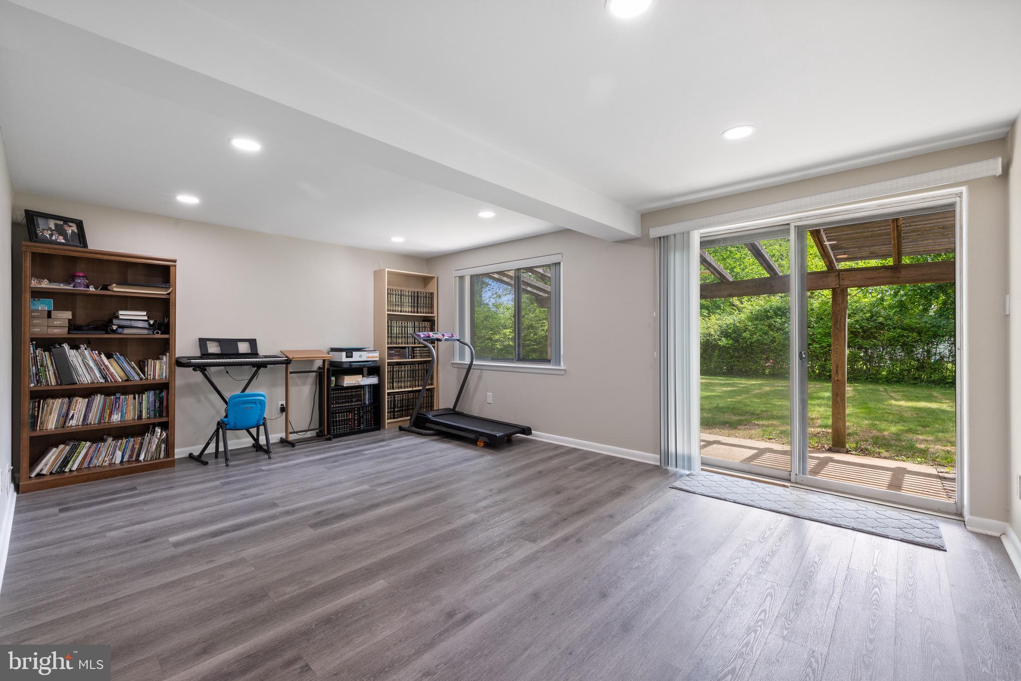 916 Hyde Road Silver Spring, MD 20902 - Photo 23 of 27 a view of a livingroom with furniture and a gym cycle