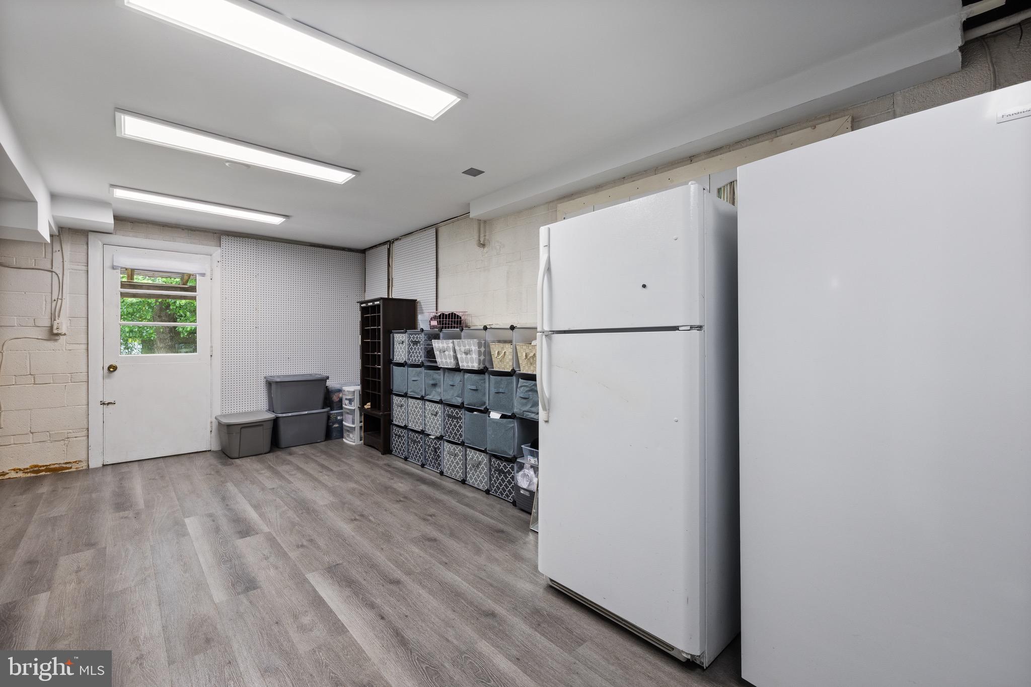 916 Hyde Road Silver Spring, MD 20902 - Photo 25 of 27 a view of kitchen with furniture and wooden floor