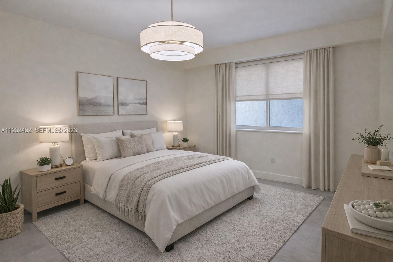 17050 North Bay Road, Unit 1102 Sunny Isles Beach, FL 33160 - Photo 6 of 10 a bedroom with a bed and a chandelier