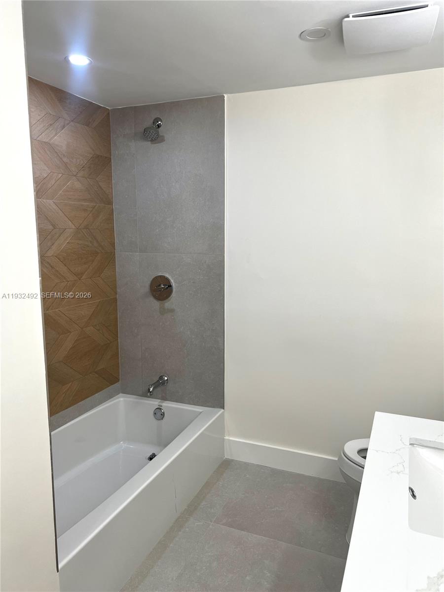17050 North Bay Road, Unit 1102 Sunny Isles Beach, FL 33160 - Photo 9 of 10 a bathroom with a bathtub and a shower
