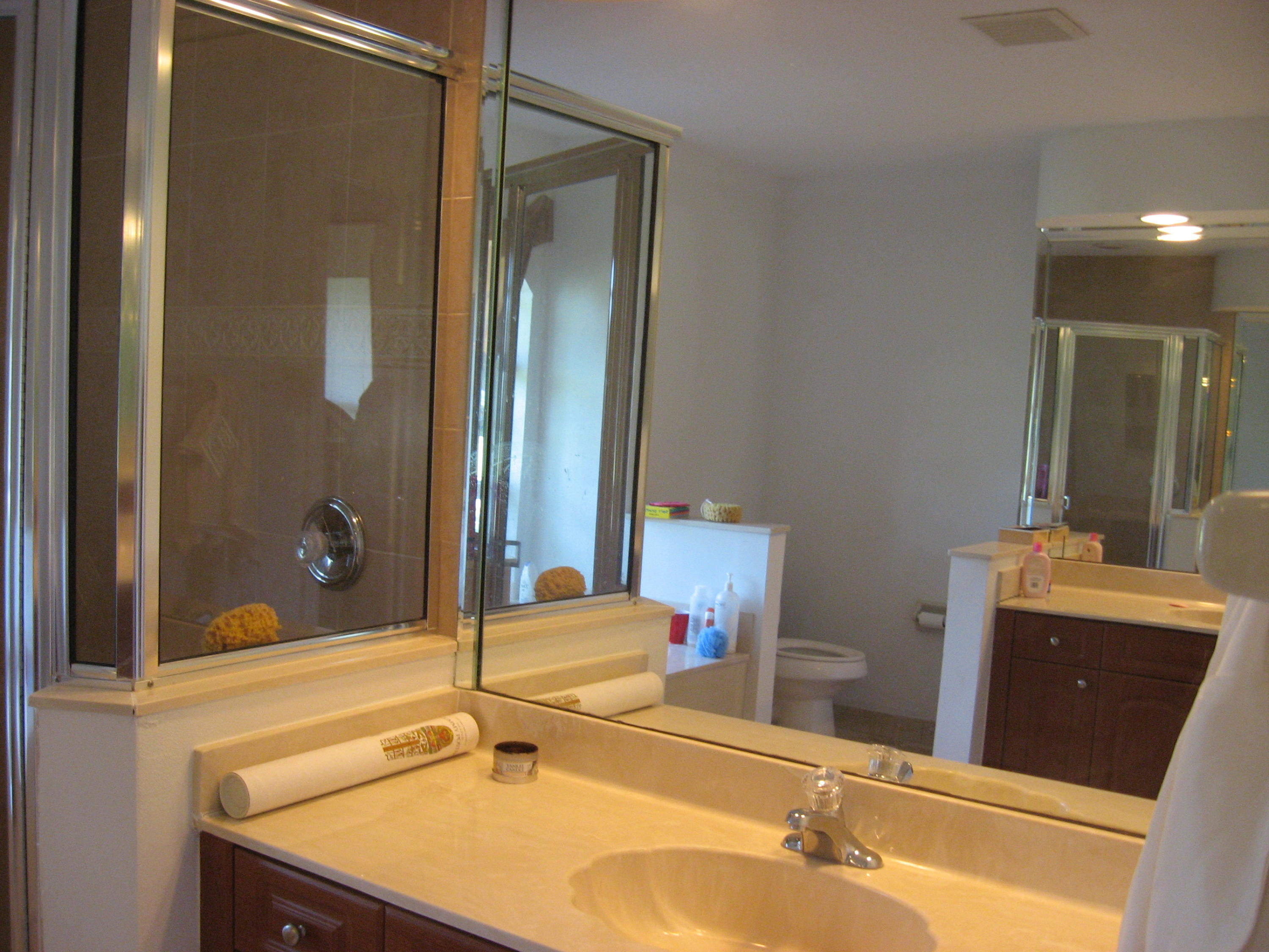 504 Southwest Undallo Road Port St. Lucie, FL 34953 - Photo 12 of 23 a bathroom with a sink and mirror