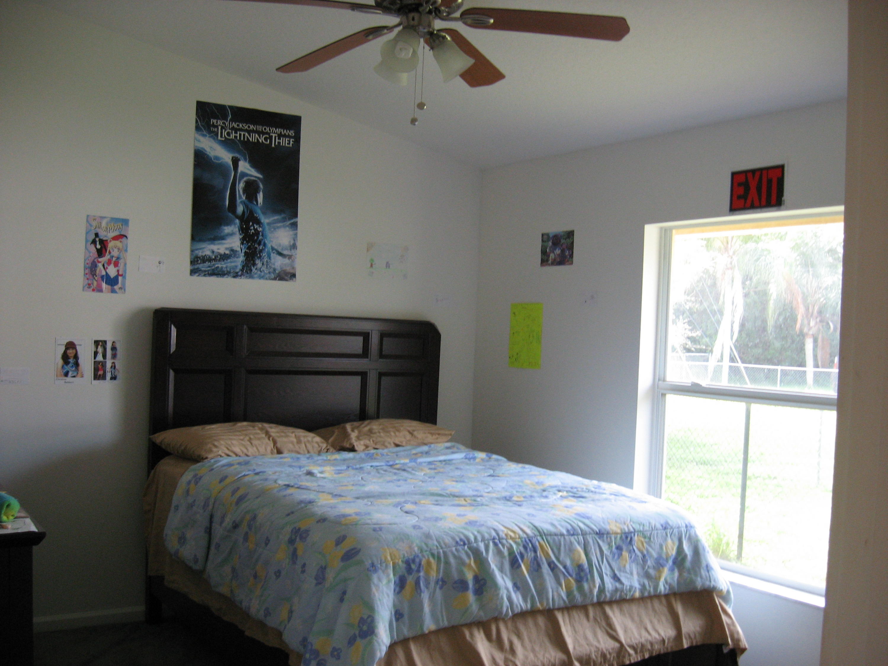 504 Southwest Undallo Road Port St. Lucie, FL 34953 - Photo 15 of 23 a bedroom with a bed and window