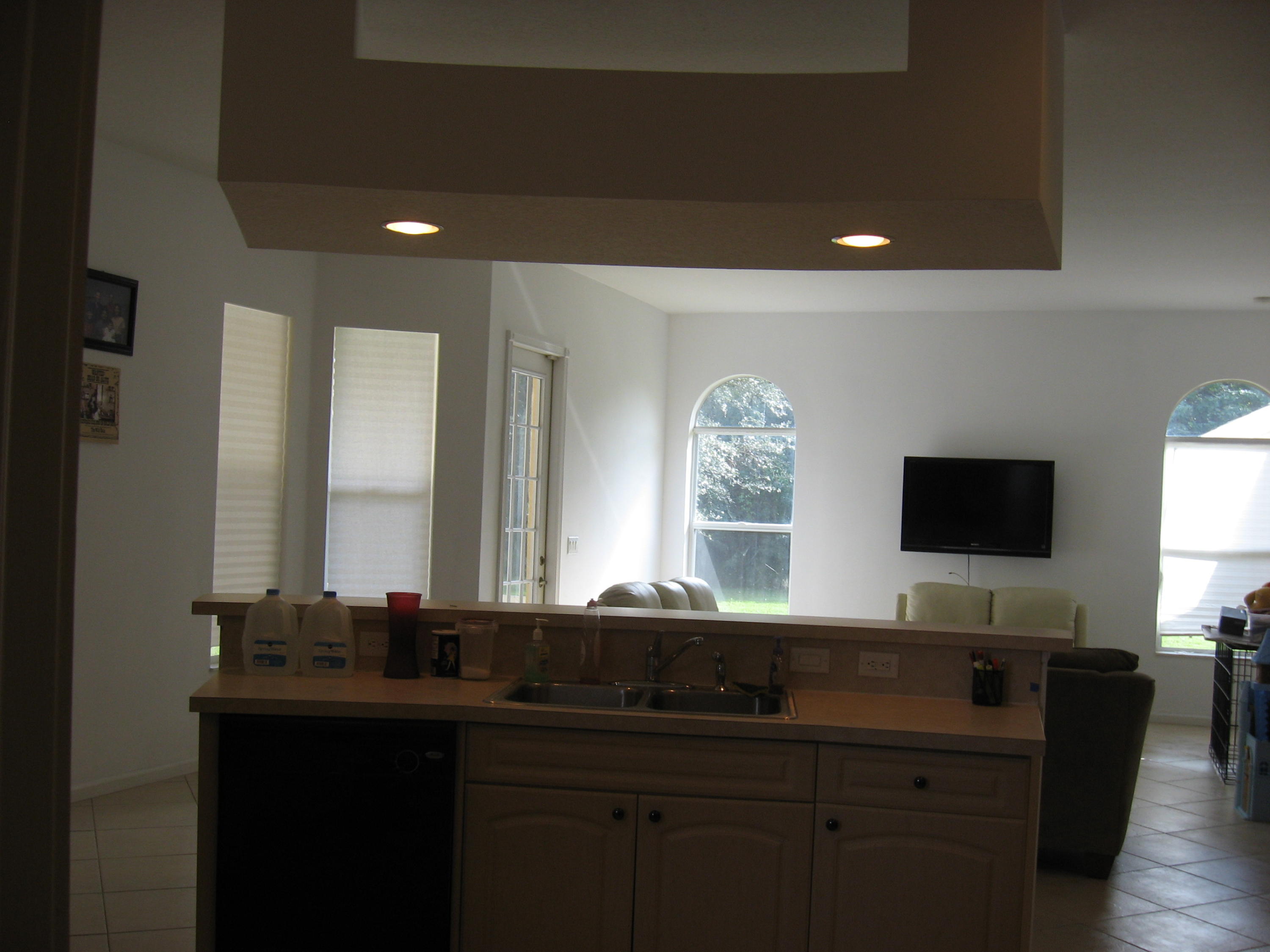 504 Southwest Undallo Road Port St. Lucie, FL 34953 - Photo 6 of 23 a bathroom with a double vanity sink and a mirror
