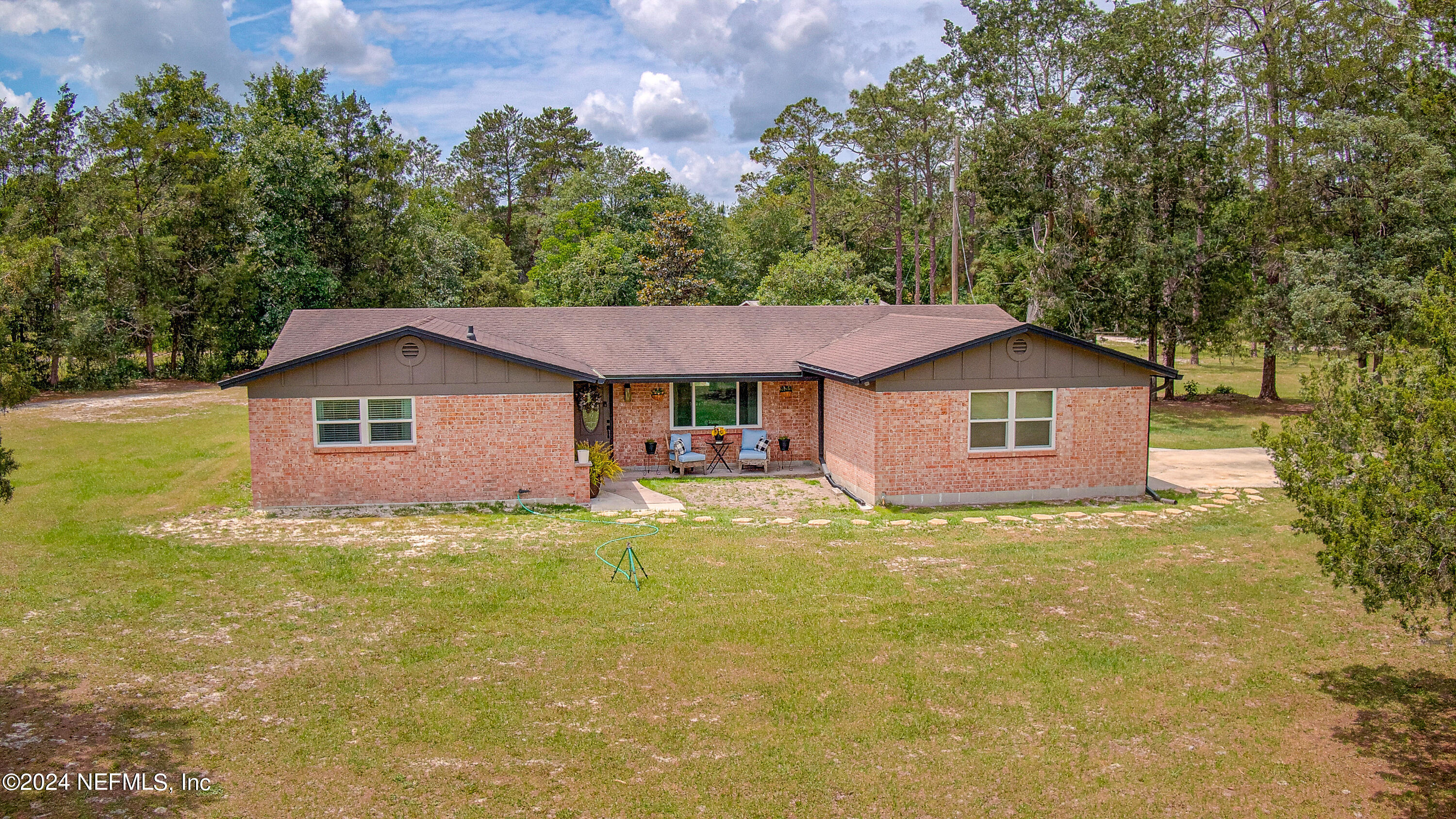 3963 Bronco Road Middleburg, FL 32068 - Photo 1 of 43 a front view of a house with yard