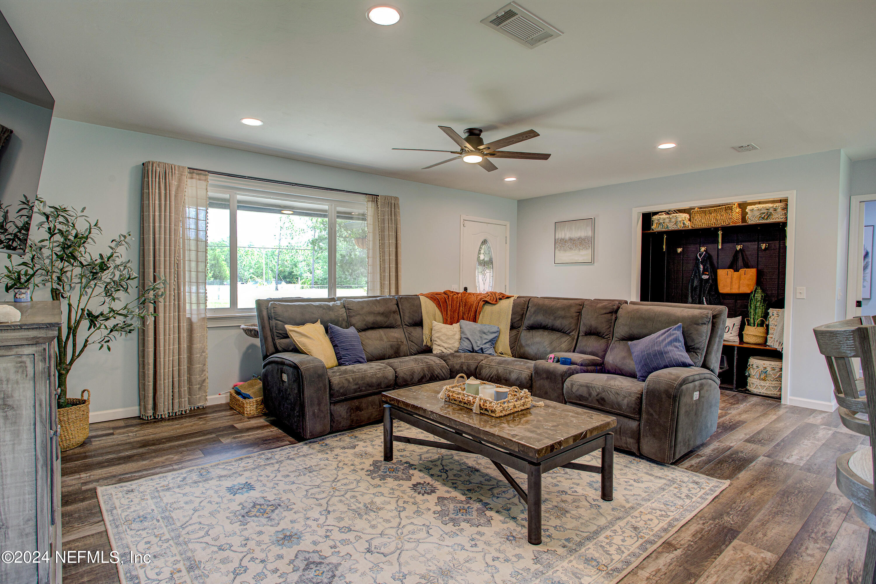 3963 Bronco Road Middleburg, FL 32068 - Photo 13 of 43 a living room with furniture and a large window