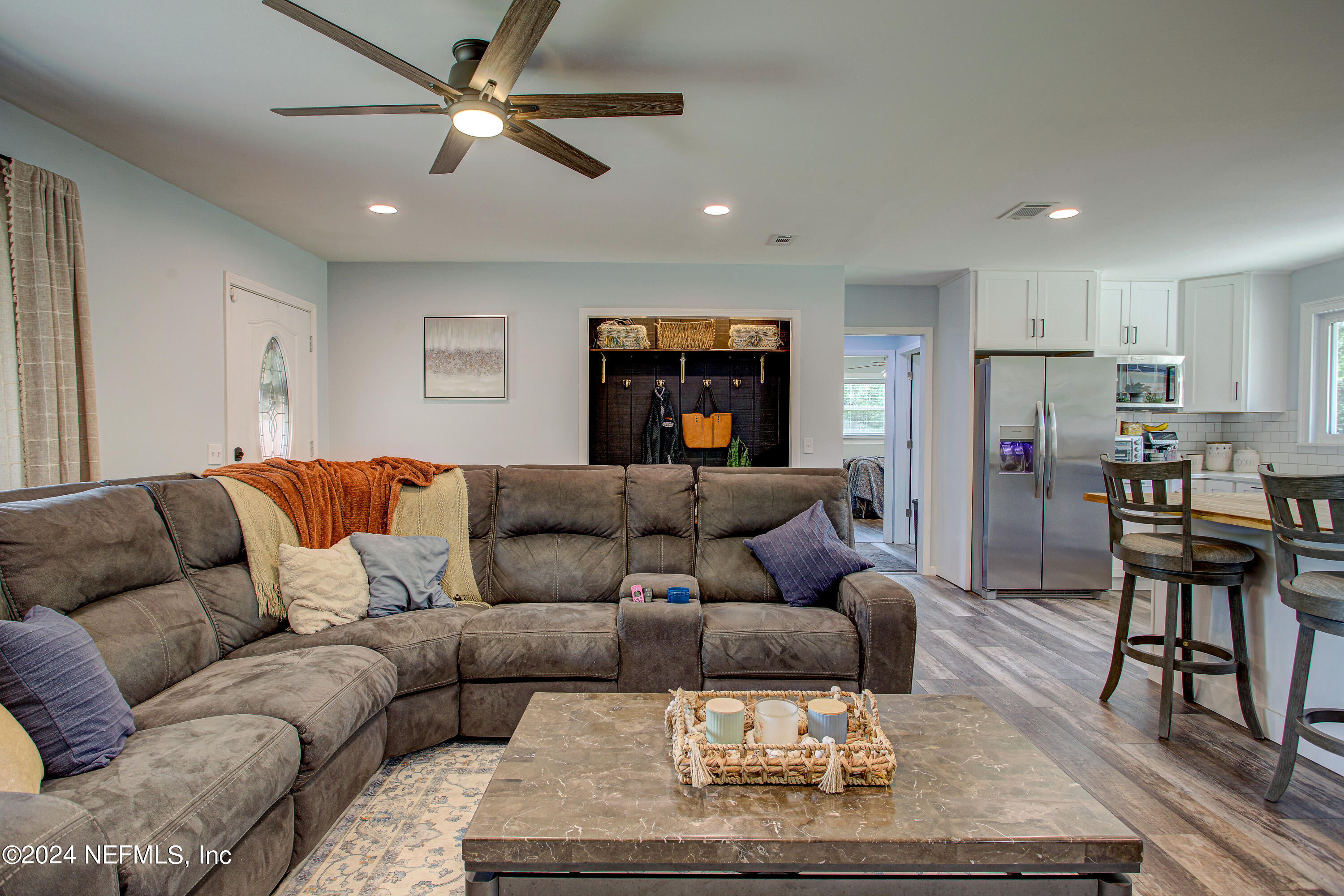 3963 Bronco Road Middleburg, FL 32068 - Photo 14 of 43 a living room with furniture and kitchen view