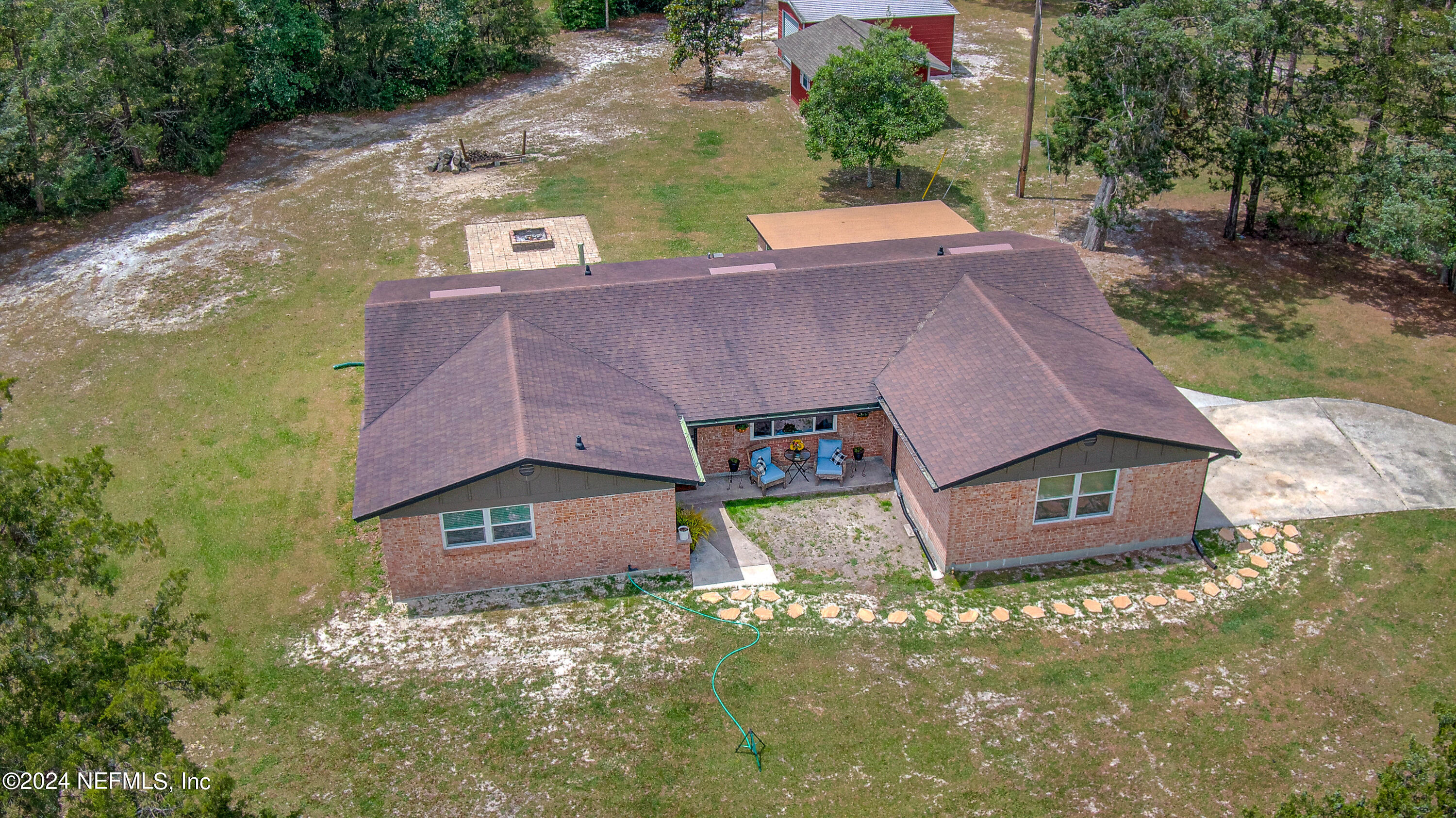 3963 Bronco Road Middleburg, FL 32068 - Photo 2 of 43 an aerial view of a house with a garden