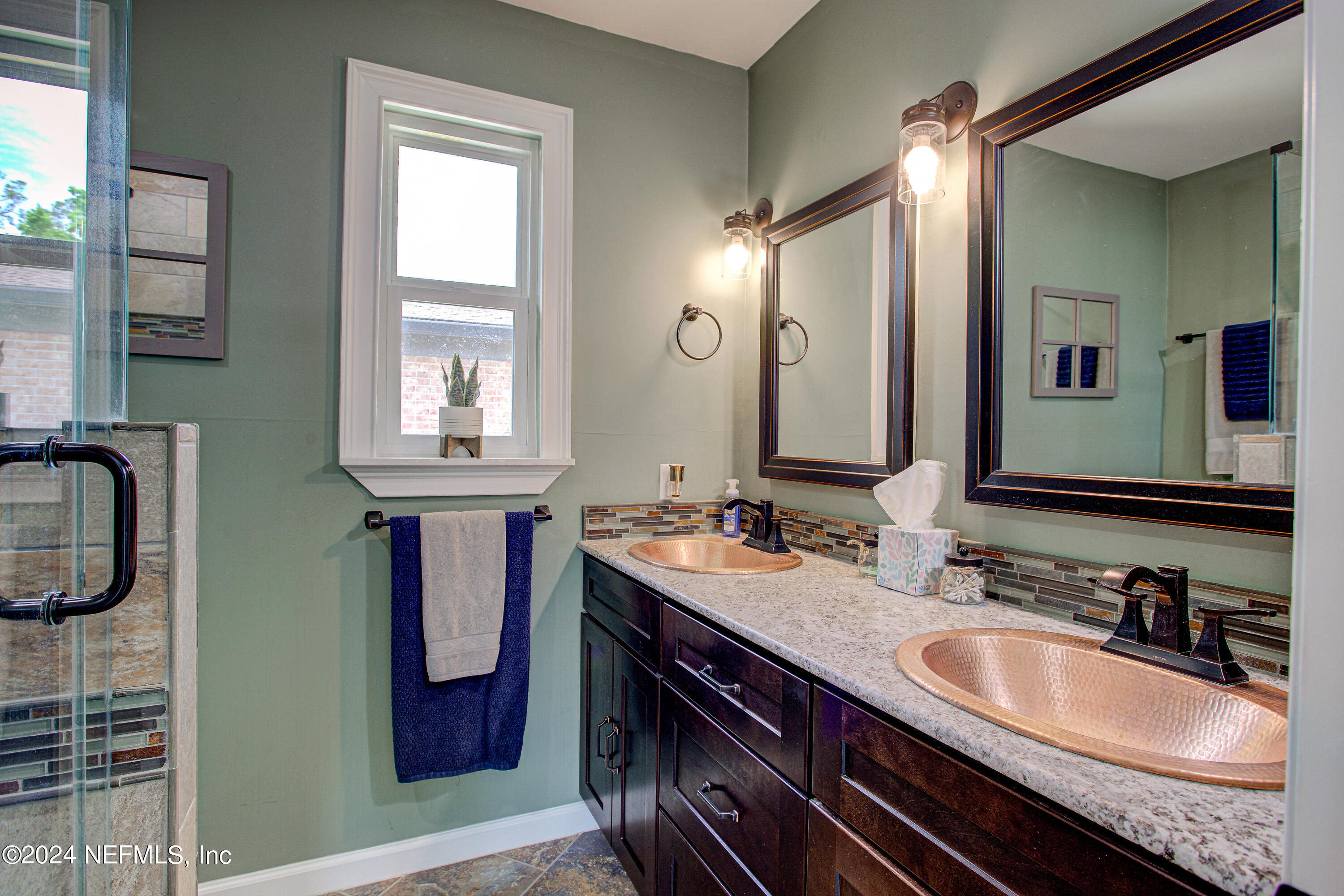 3963 Bronco Road Middleburg, FL 32068 - Photo 31 of 43 a bathroom with a sink double vanity and a mirror