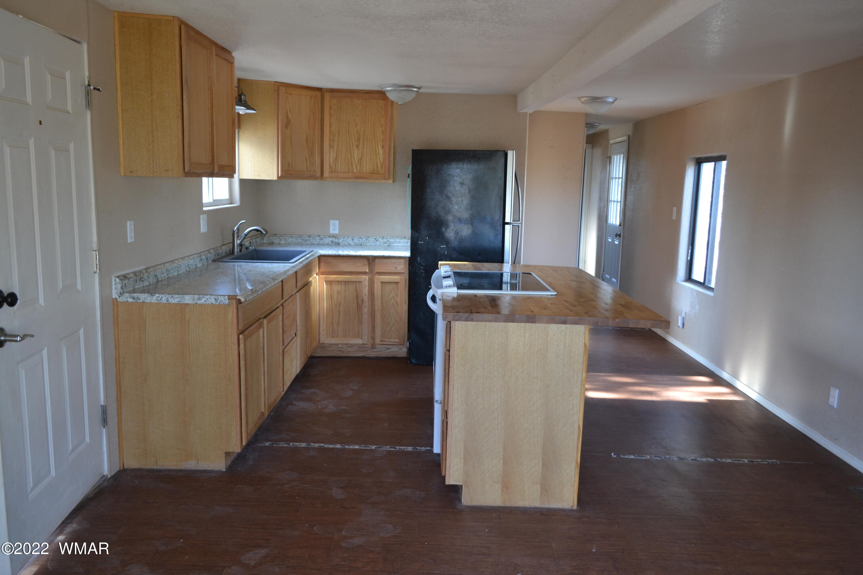 4330 Mountain View Road Snowflake, AZ 85937 - Photo 4 of 20 a kitchen with granite countertop a sink and a stove top oven