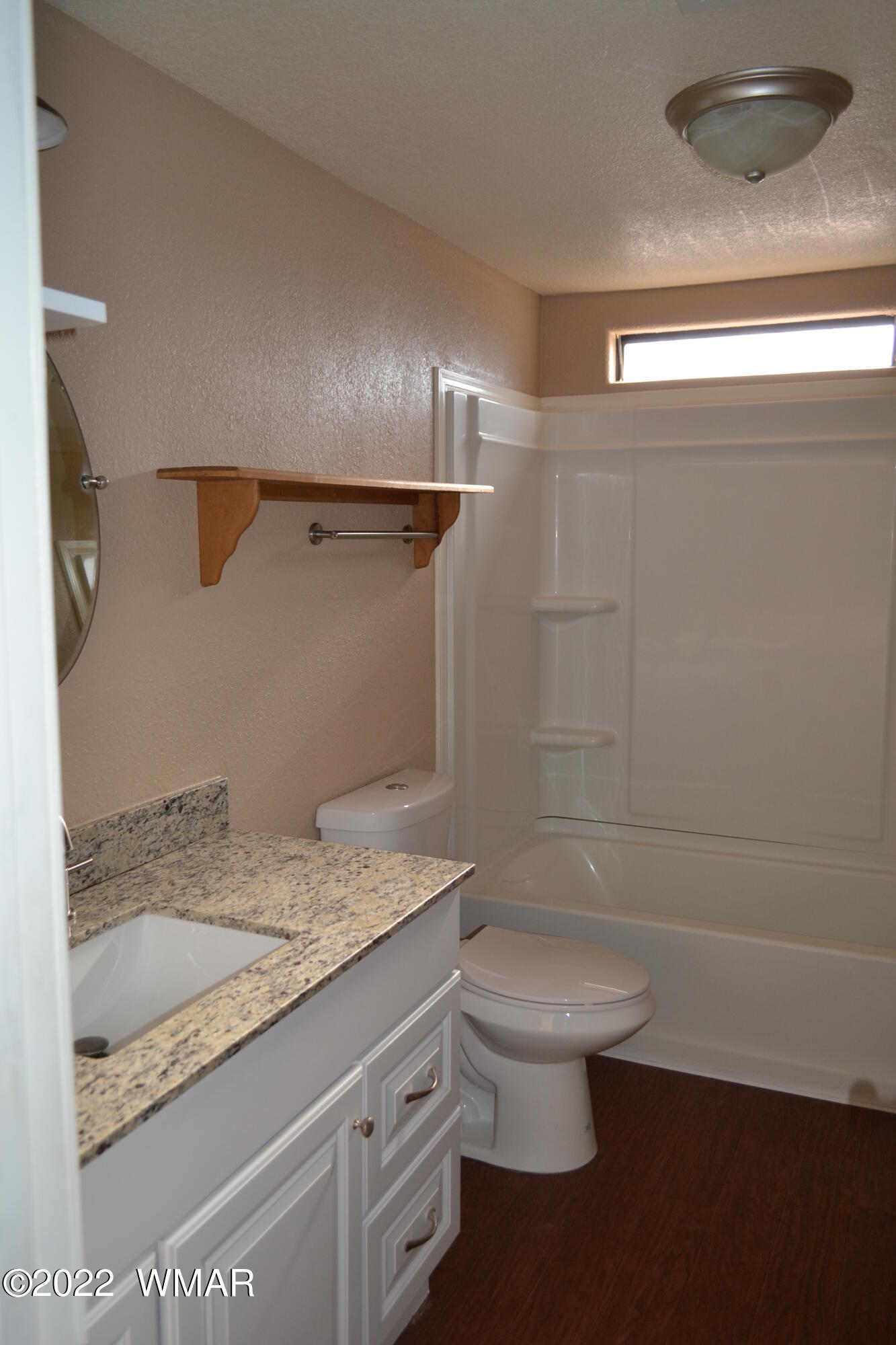 4330 Mountain View Road Snowflake, AZ 85937 - Photo 7 of 20 a bathroom with a granite countertop sink a toilet and shower