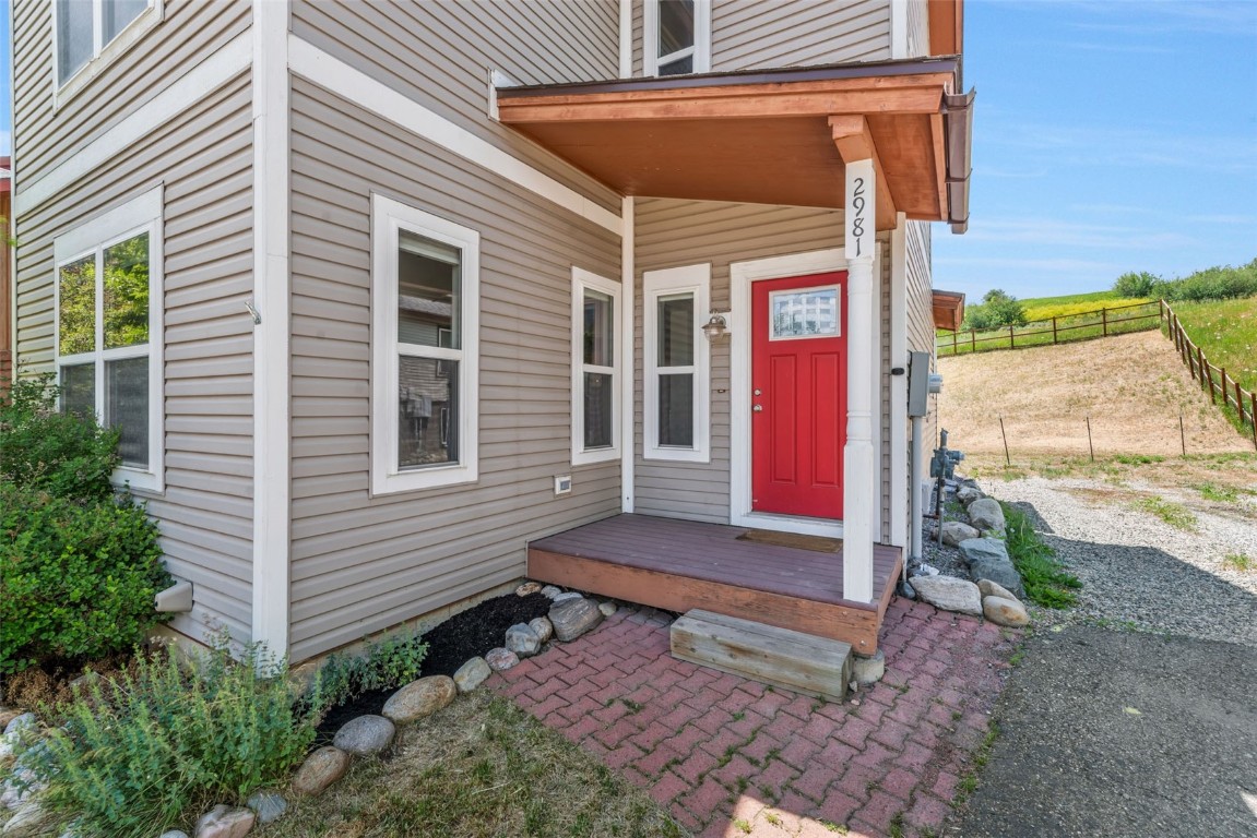 2981 Abbey Road Steamboat Springs, CO 80487 - Photo 11 of 27 a view of a house with backyard and porch