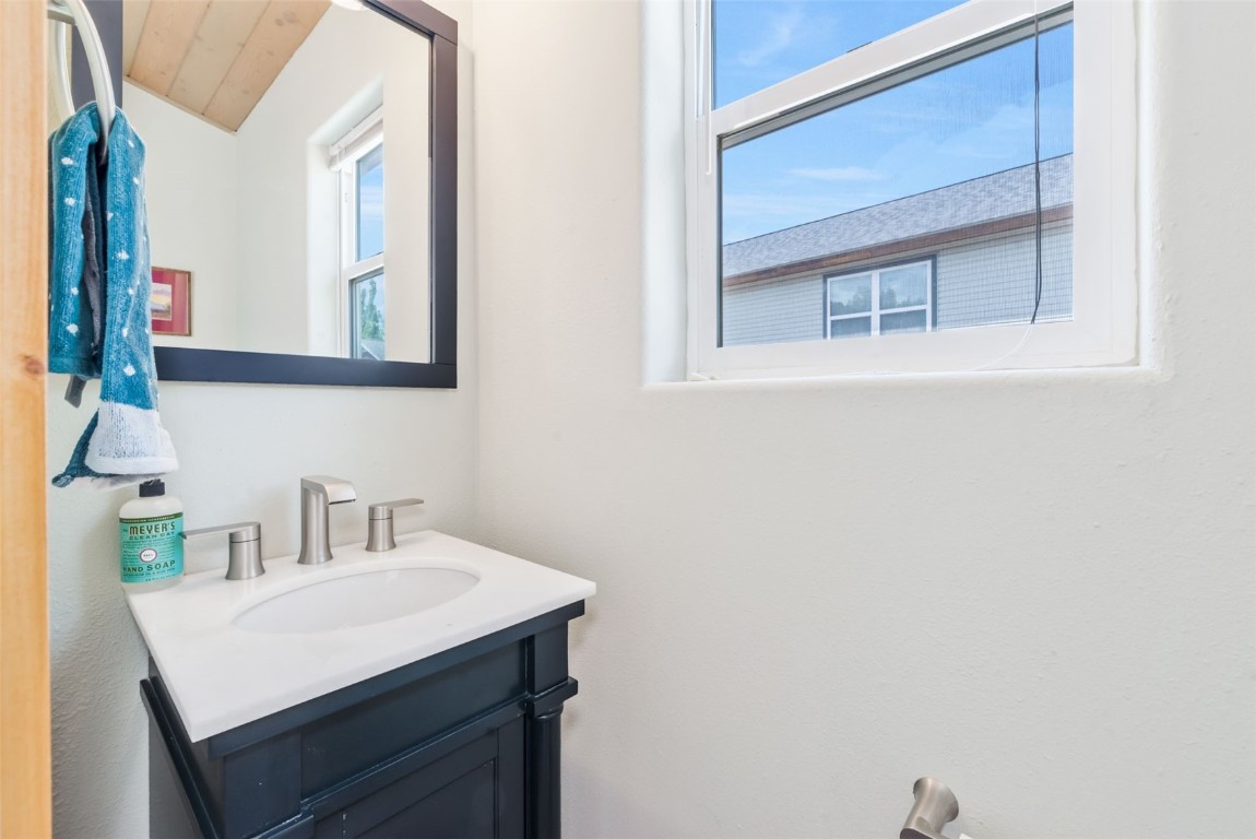 2981 Abbey Road Steamboat Springs, CO 80487 - Photo 16 of 27 a bathroom with a sink vanity and a mirror