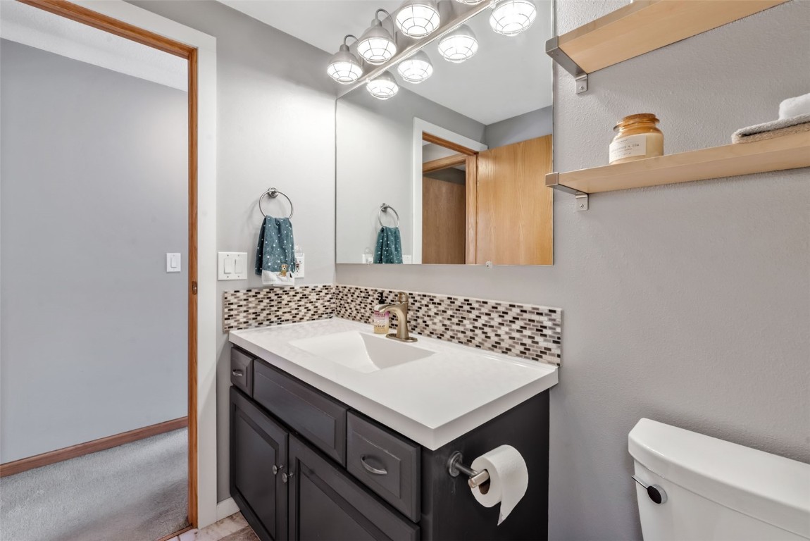 2981 Abbey Road Steamboat Springs, CO 80487 - Photo 17 of 27 a bathroom with a sink a toilet and a mirror