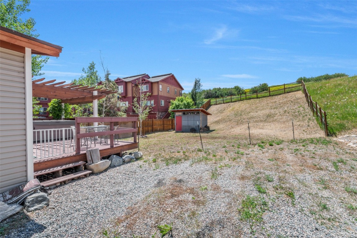 2981 Abbey Road Steamboat Springs, CO 80487 - Photo 18 of 27 a view of a house with backyard and sitting area