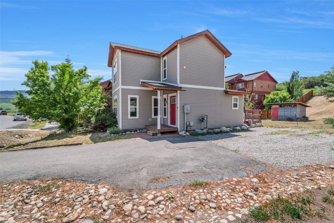 2981 Abbey Road Steamboat Springs, CO 80487 - Photo 19 of 27 a front view of a house with a yard and a garage