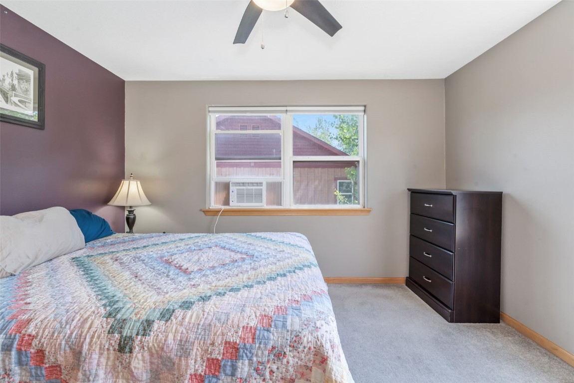 2981 Abbey Road Steamboat Springs, CO 80487 - Photo 21 of 27 a bedroom with a bed and a window