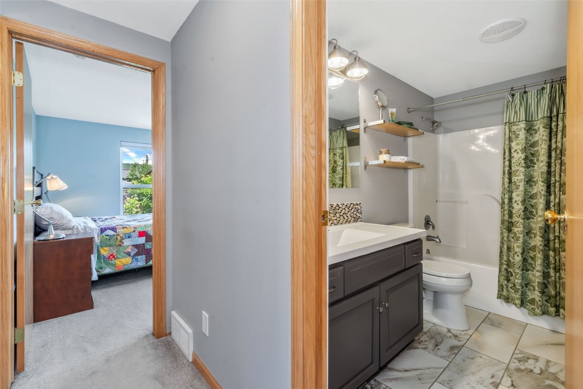 2981 Abbey Road Steamboat Springs, CO 80487 - Photo 23 of 27 a bathroom with a sink a toilet and shower