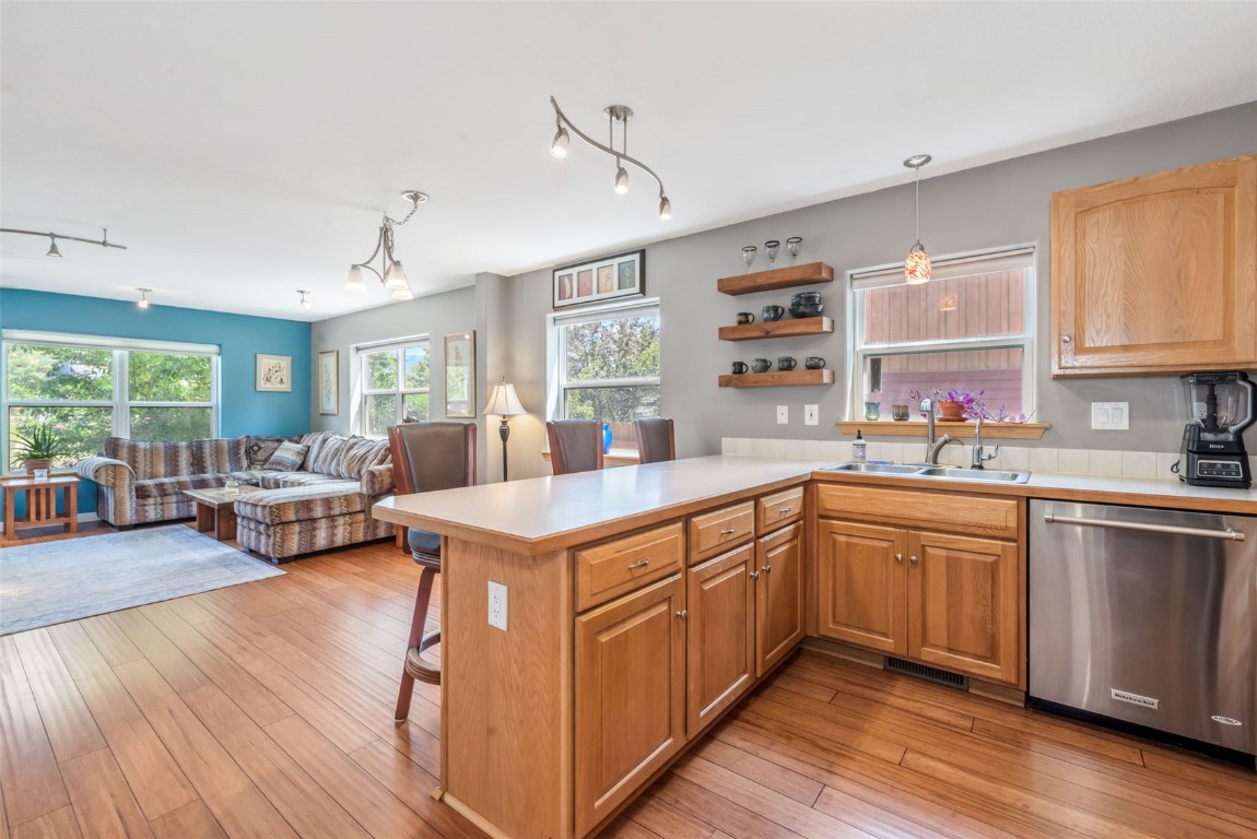 2981 Abbey Road Steamboat Springs, CO 80487 - Photo 8 of 27 a kitchen with sink cabinets and wooden floor