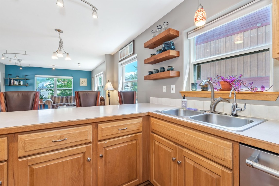2981 Abbey Road Steamboat Springs, CO 80487 - Photo 9 of 27 a kitchen with stainless steel appliances granite countertop a sink and dishwasher with cabinets