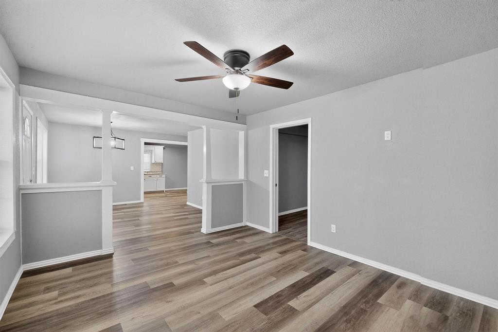 400 South Oak Street Ranger, TX 76470 - Photo 14 of 38 a view of an empty room and wooden floor