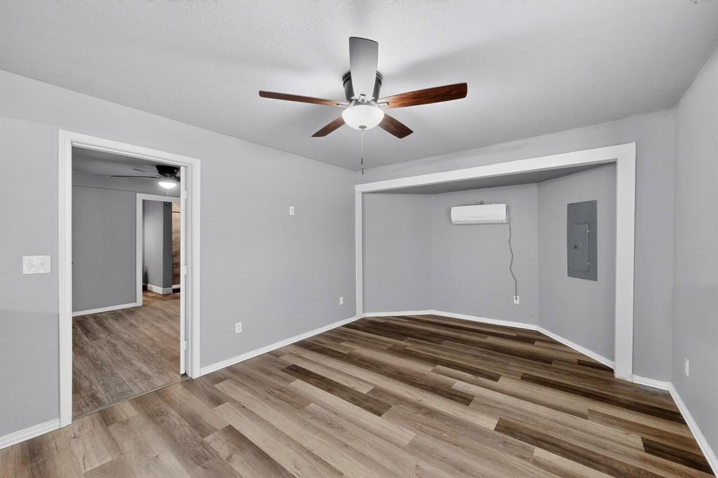 400 South Oak Street Ranger, TX 76470 - Photo 15 of 38 a bedroom with bed and window