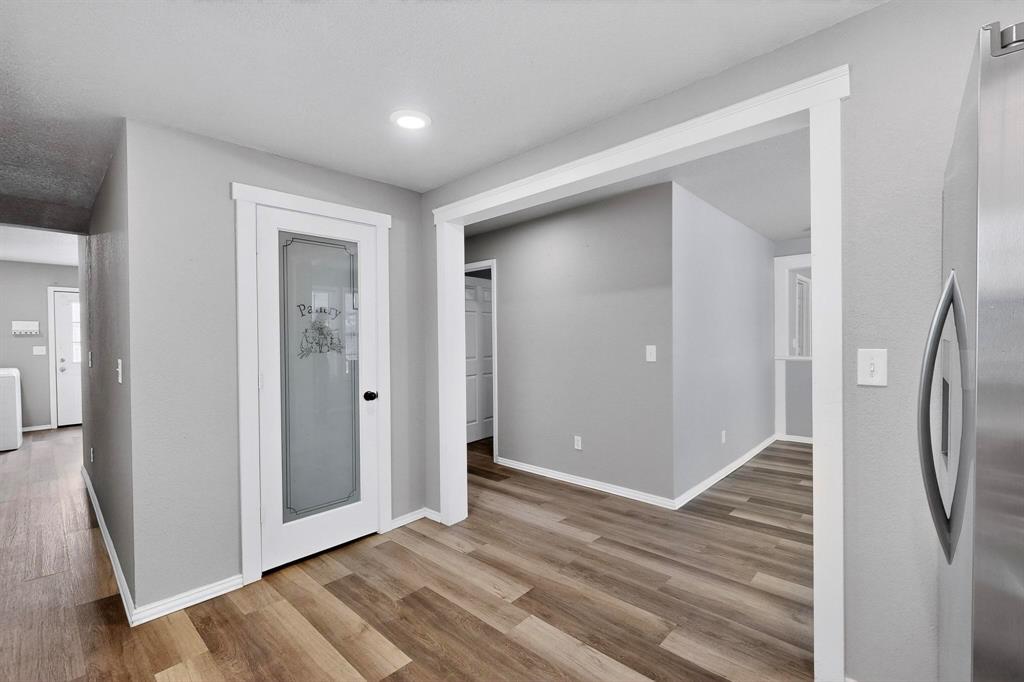 400 South Oak Street Ranger, TX 76470 - Photo 18 of 38 a view of a hallway with wooden floor