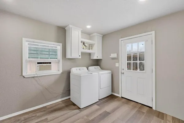 a living room with a couch and a window