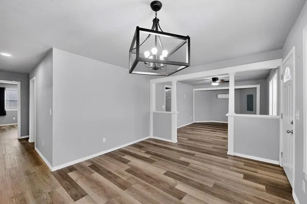 a view of entryway and hall with wooden floor