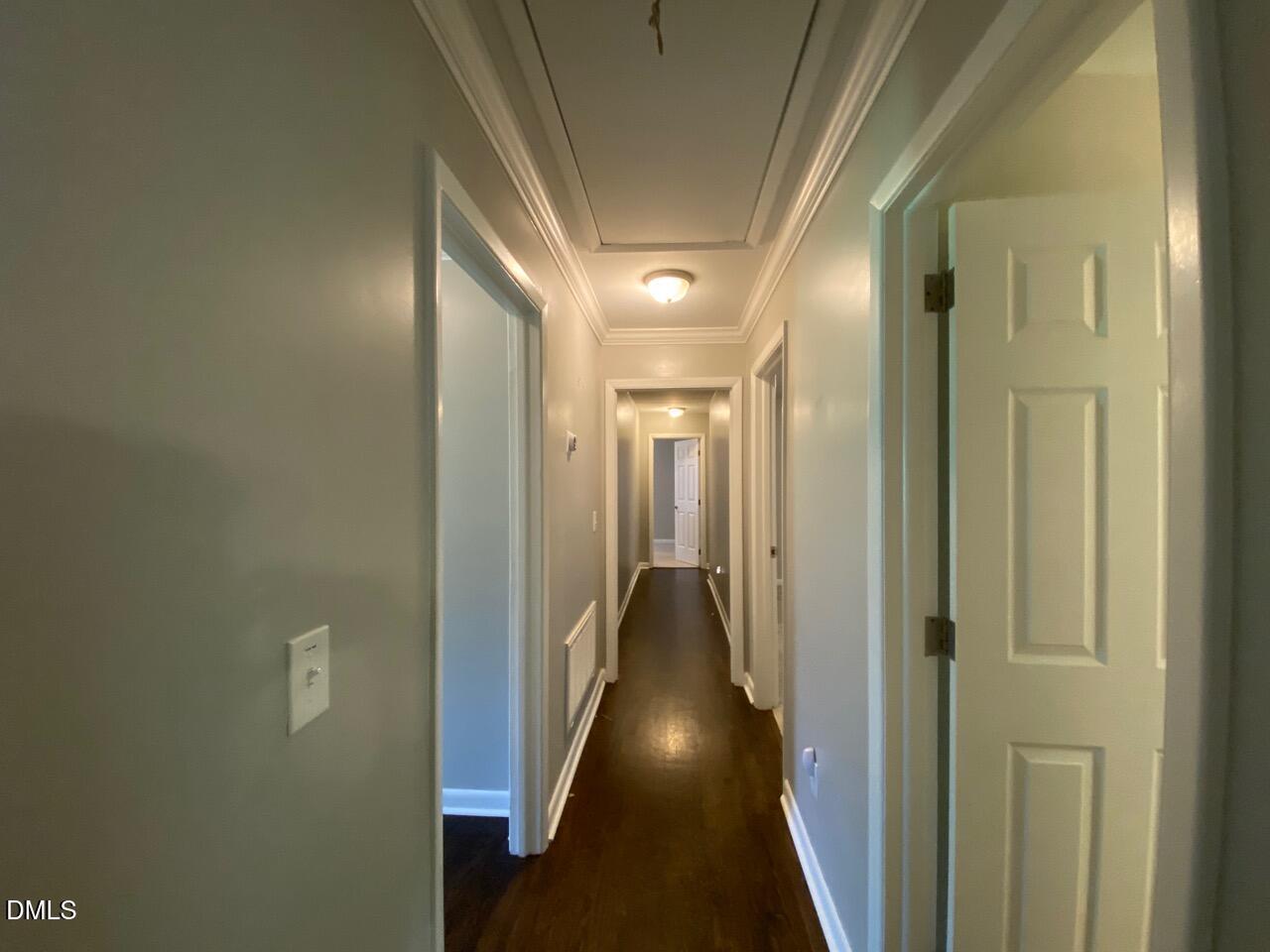 2910 Haven Road Raleigh, NC 27610 - Photo 13 of 26 a view of hallway with wooden floor