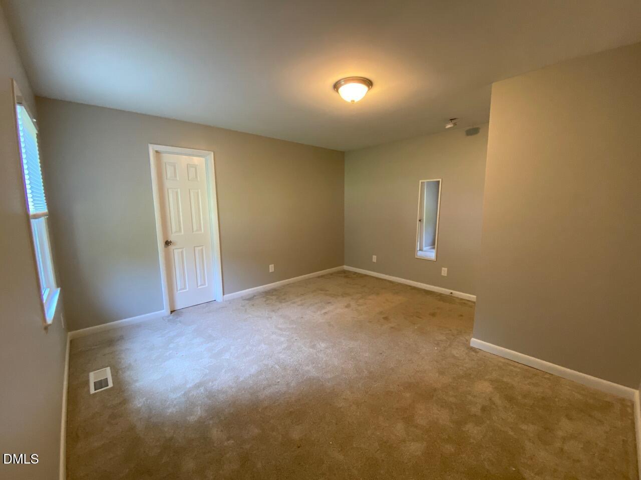 2910 Haven Road Raleigh, NC 27610 - Photo 18 of 26 an empty room with a natural light
