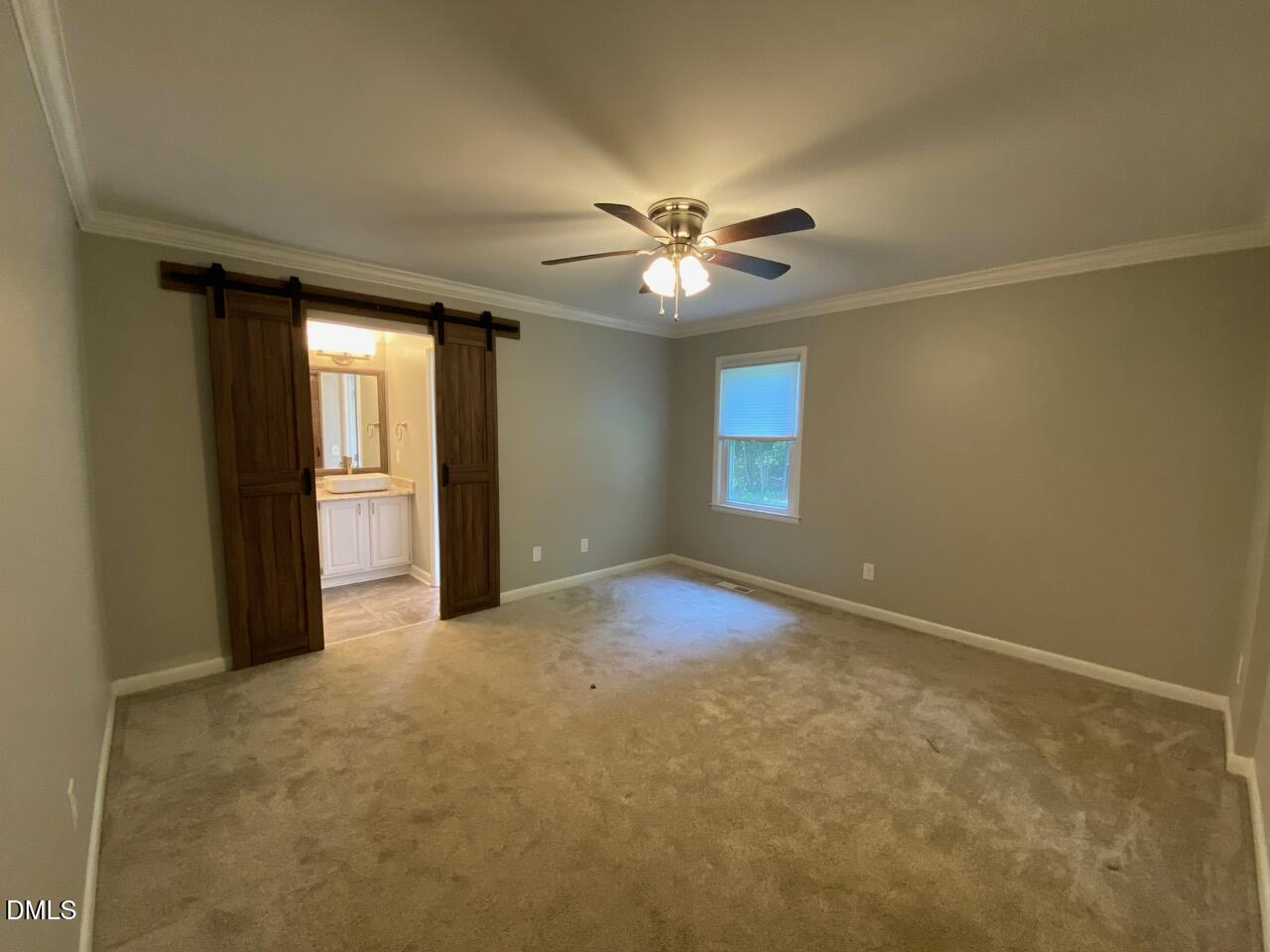 2910 Haven Road Raleigh, NC 27610 - Photo 20 of 26 an empty room with windows and fan