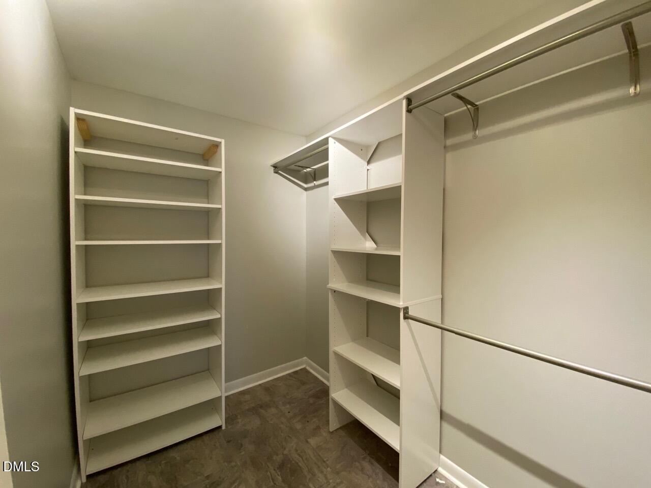 2910 Haven Road Raleigh, NC 27610 - Photo 21 of 26 a view of walk in closet with empty racks