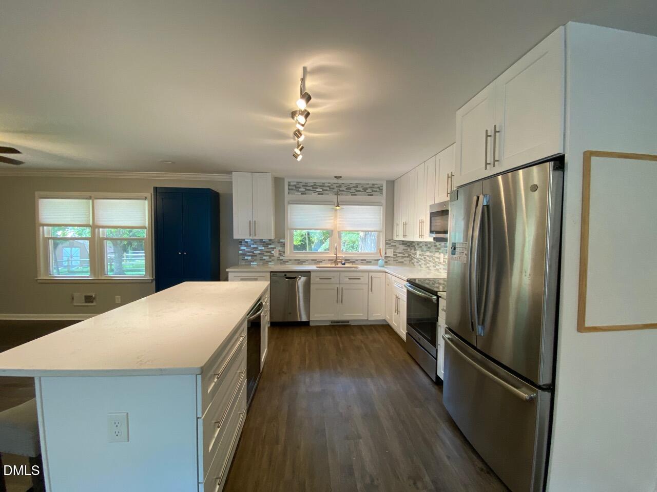 2910 Haven Road Raleigh, NC 27610 - Photo 7 of 26 a kitchen with a refrigerator a sink and dishwasher