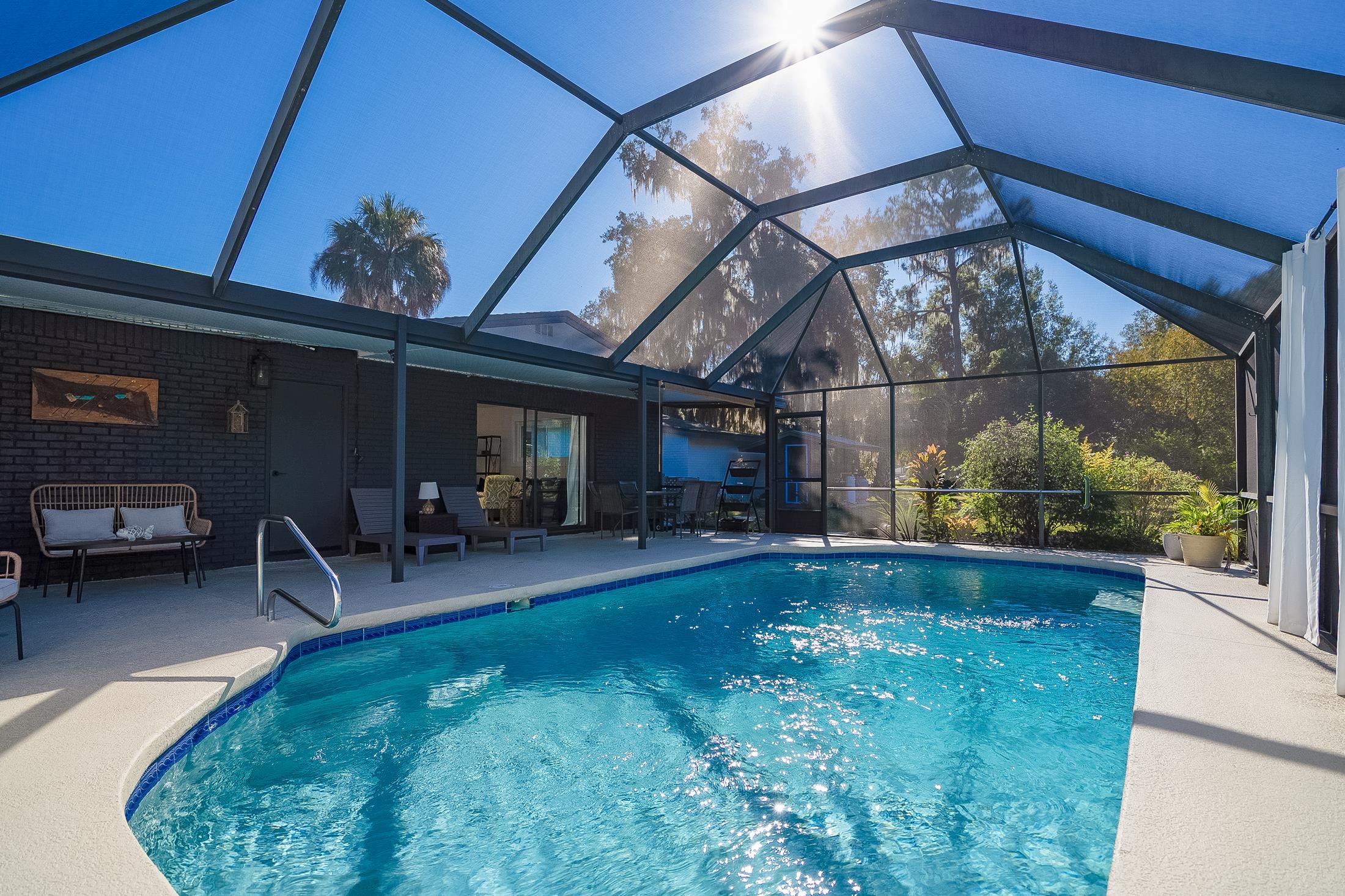 123 Esperanza Grove Road East Palatka, FL 32131 - Photo 21 of 59 Swimming pool featuring a patio, a sunroom, and a lanai