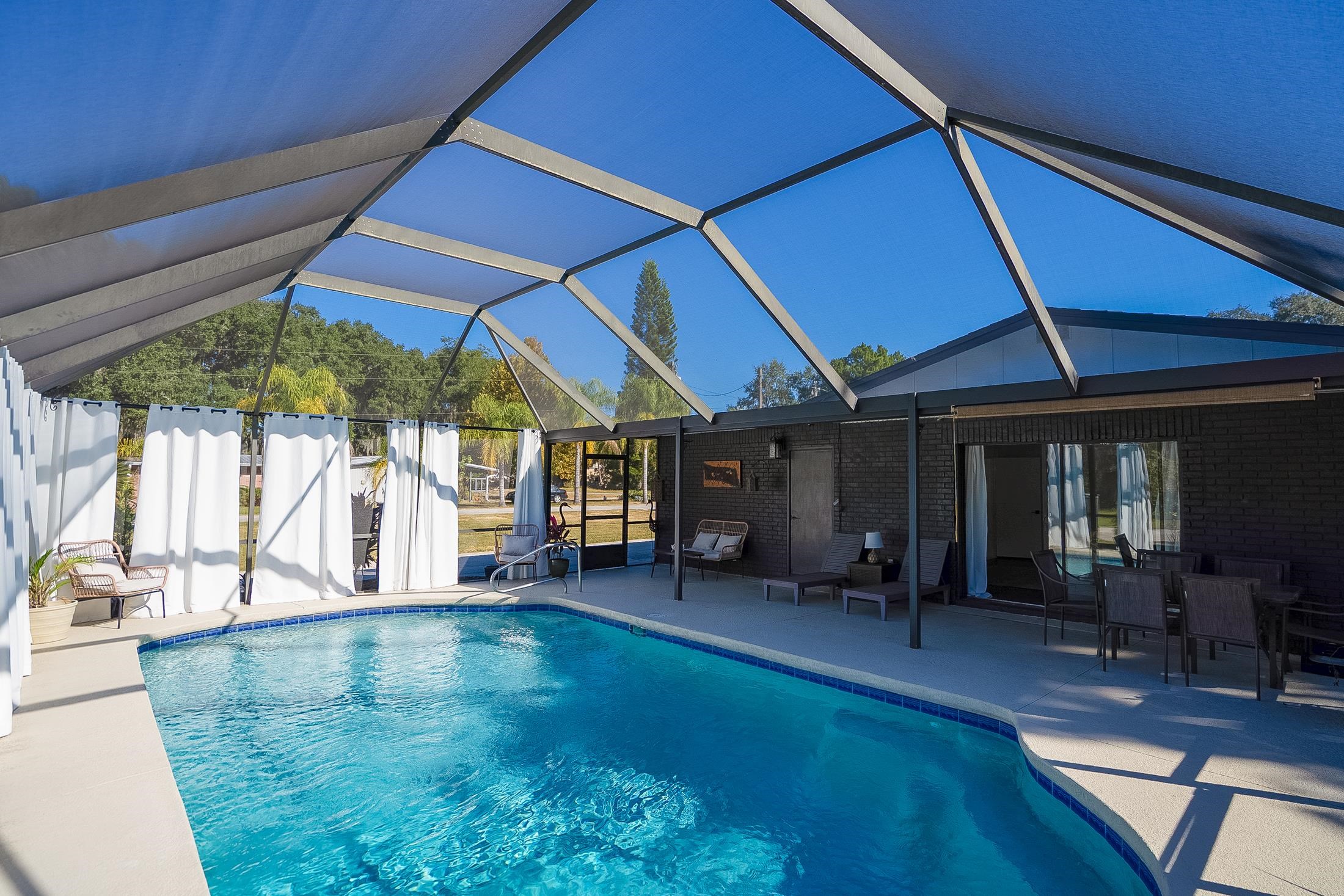 123 Esperanza Grove Road East Palatka, FL 32131 - Photo 23 of 59 Outdoor pool with a sunroom, a lanai, and a patio