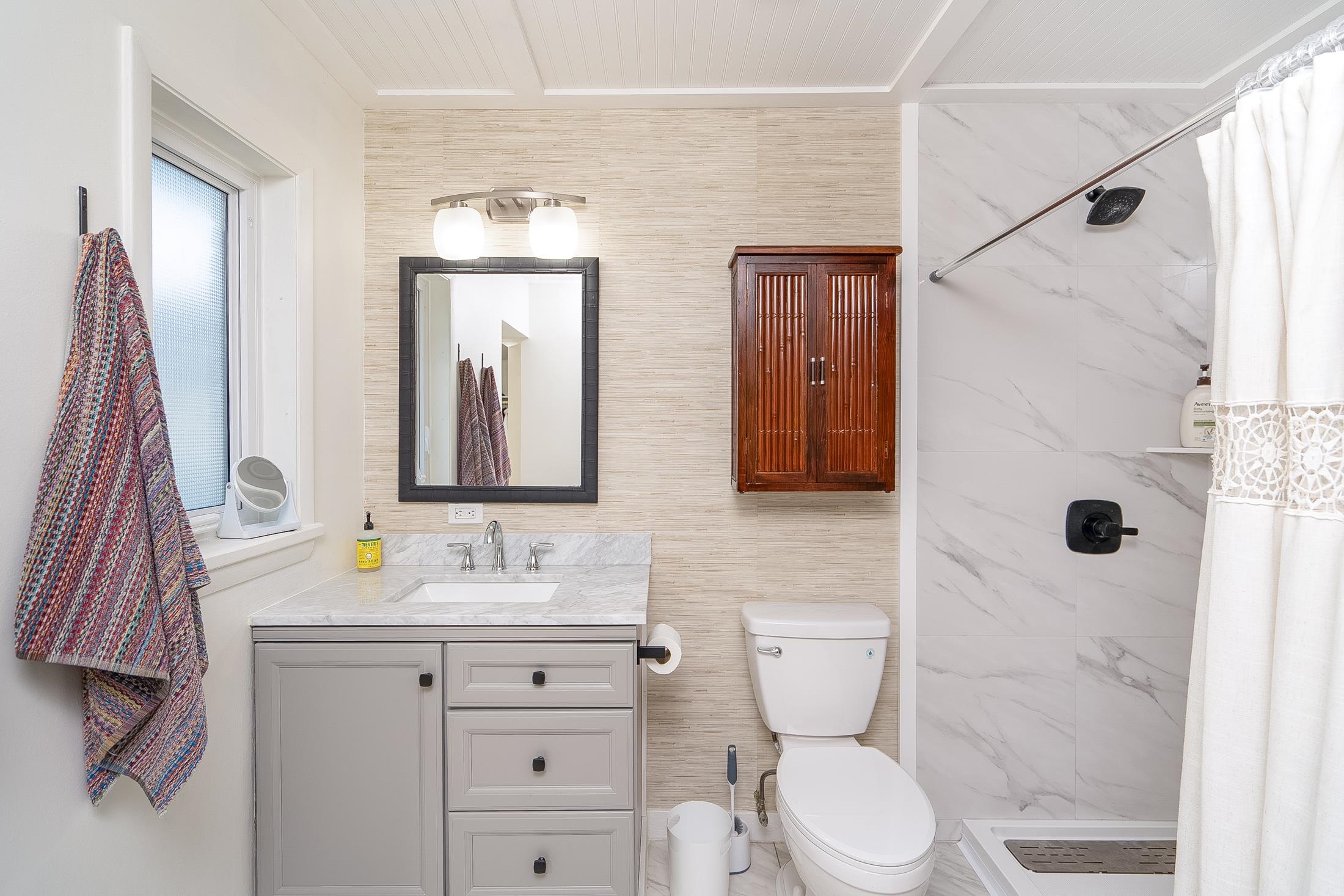 123 Esperanza Grove Road East Palatka, FL 32131 - Photo 27 of 59 Full bath featuring a marble finish shower, vanity, and tile walls